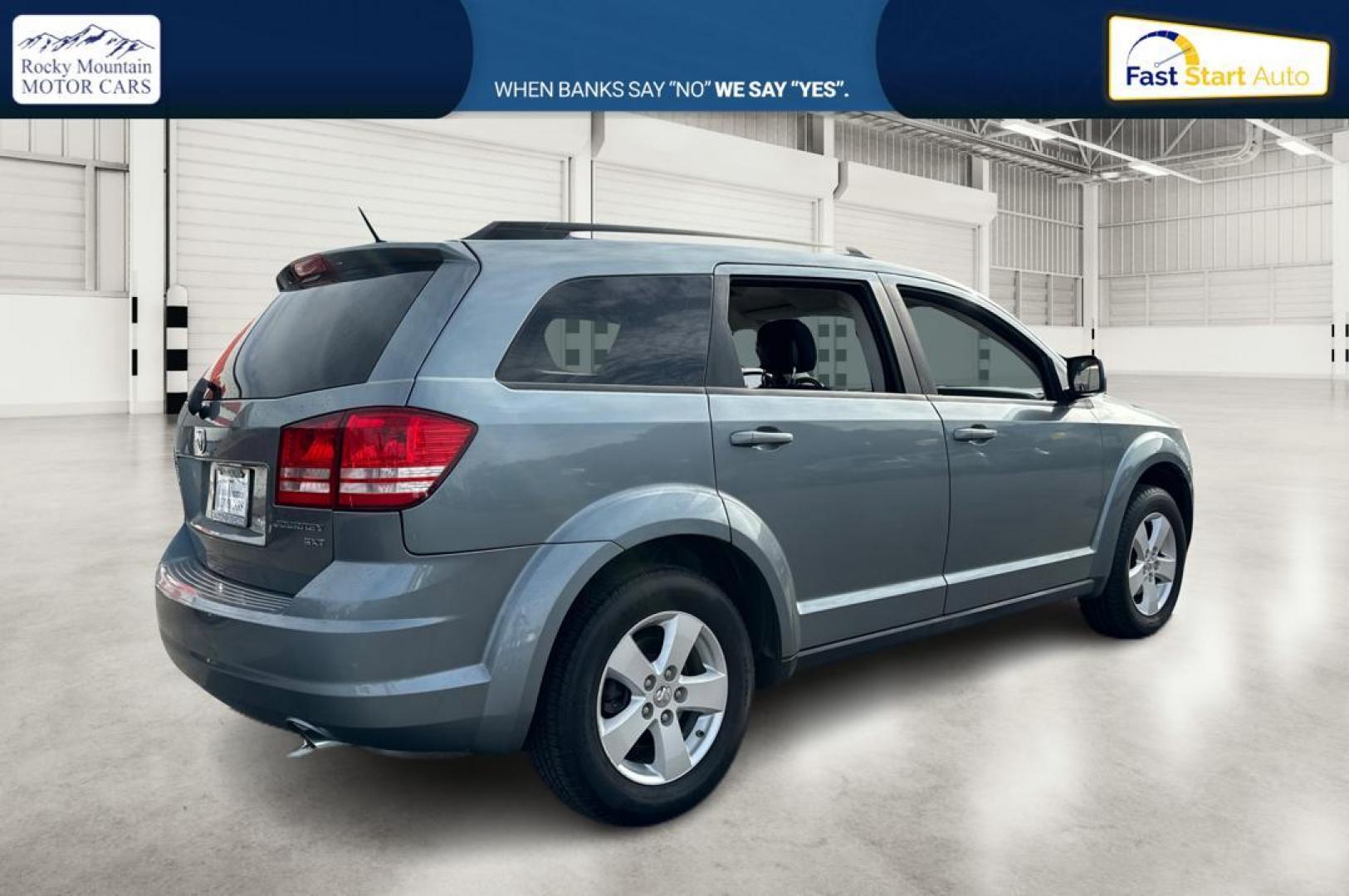 2010 Blue Dodge Journey SXT (3D4PG5FV9AT) with an 3.5L V6 SOHC 24V engine, 6-Speed Automatic transmission, located at 767 S State Road, Pleasant Grove, UT, 84062, (801) 785-1058, 40.354839, -111.736687 - Photo#2