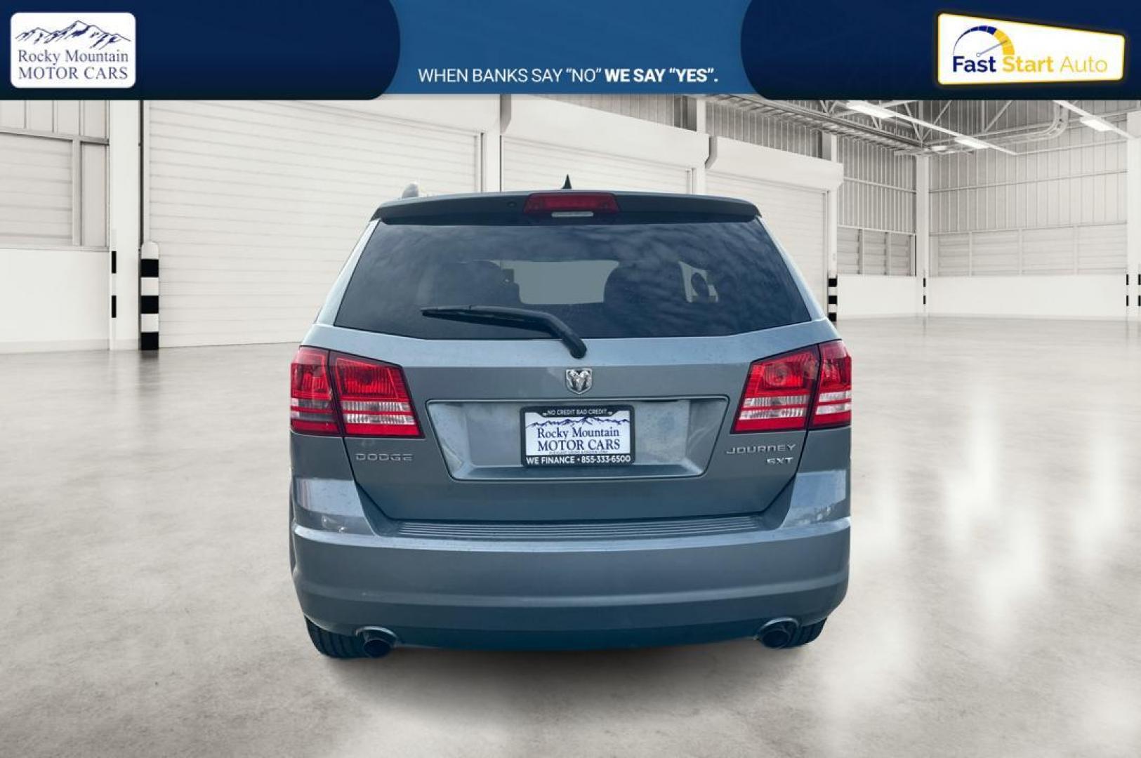 2010 Blue Dodge Journey SXT (3D4PG5FV9AT) with an 3.5L V6 SOHC 24V engine, 6-Speed Automatic transmission, located at 767 S State Road, Pleasant Grove, UT, 84062, (801) 785-1058, 40.354839, -111.736687 - Photo#3