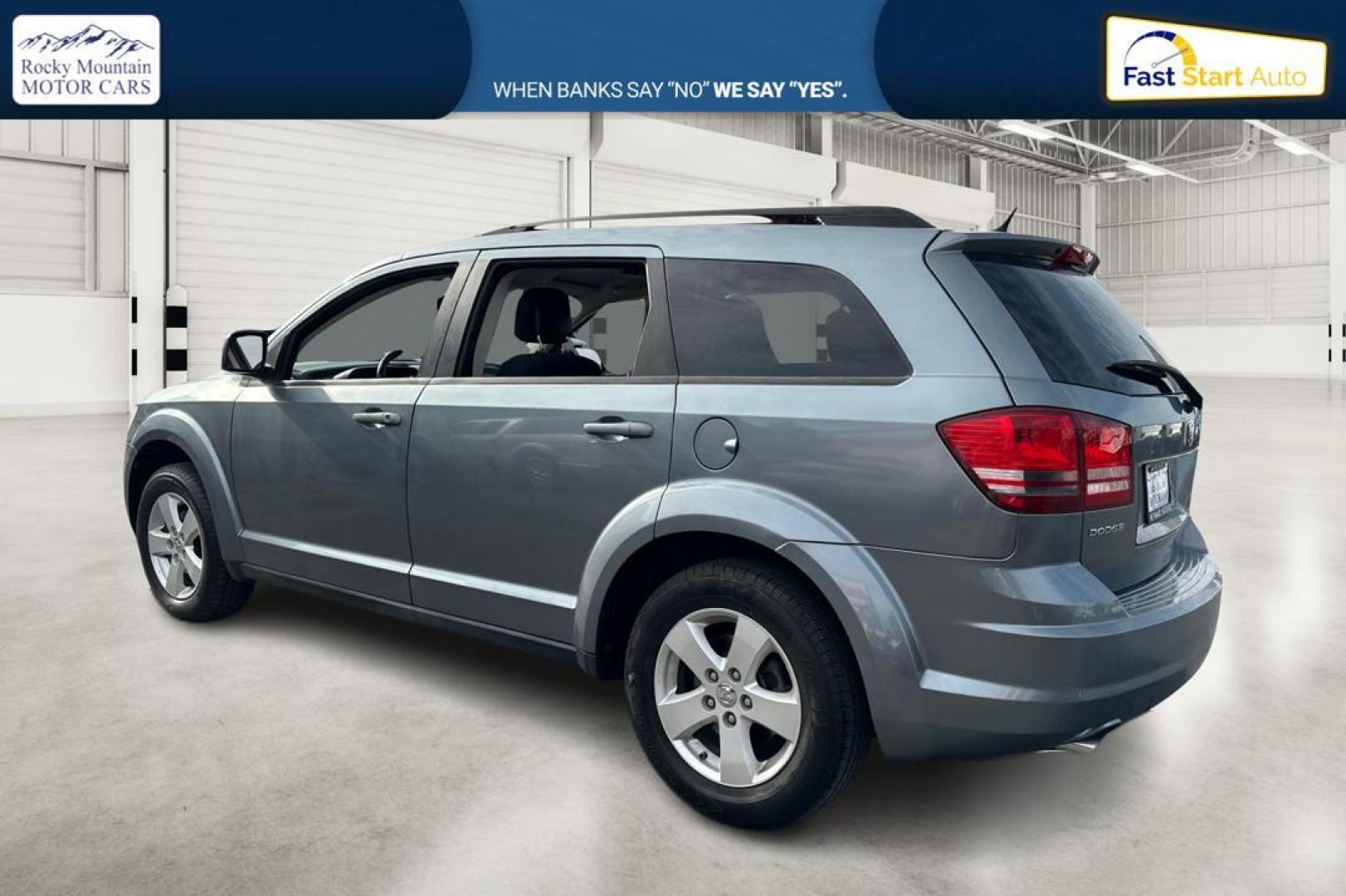 2010 Blue Dodge Journey SXT (3D4PG5FV9AT) with an 3.5L V6 SOHC 24V engine, 6-Speed Automatic transmission, located at 767 S State Road, Pleasant Grove, UT, 84062, (801) 785-1058, 40.354839, -111.736687 - Photo#4