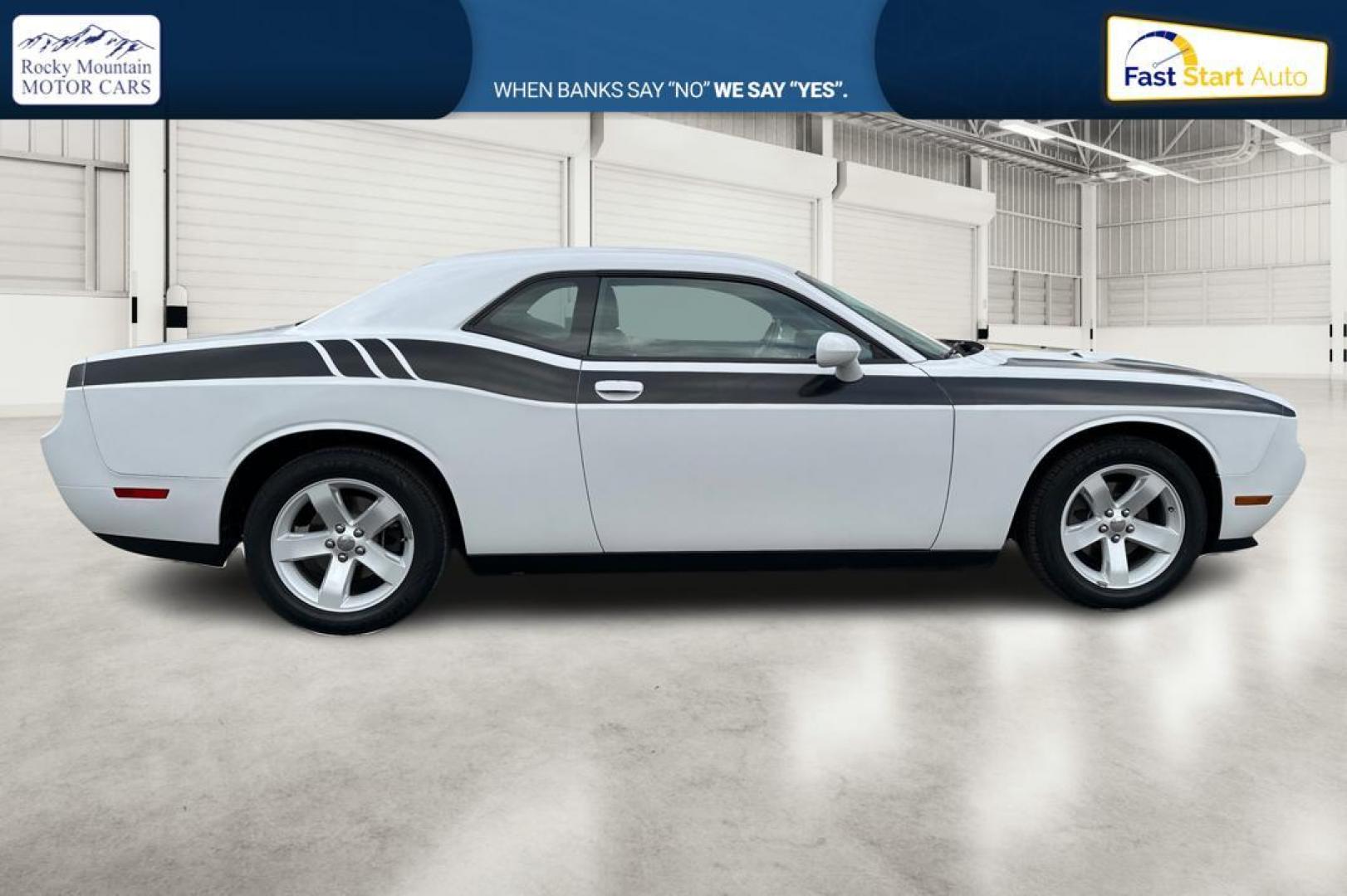 2012 White Dodge Challenger SXT (2C3CDYAG7CH) with an 3.6L V6 DOHC 24V engine, 4-Speed Automatic transmission, located at 344 S Washington Blvd, Ogden, UT, 84404, (801) 399-1799, 41.255482, -111.970848 - Photo#1