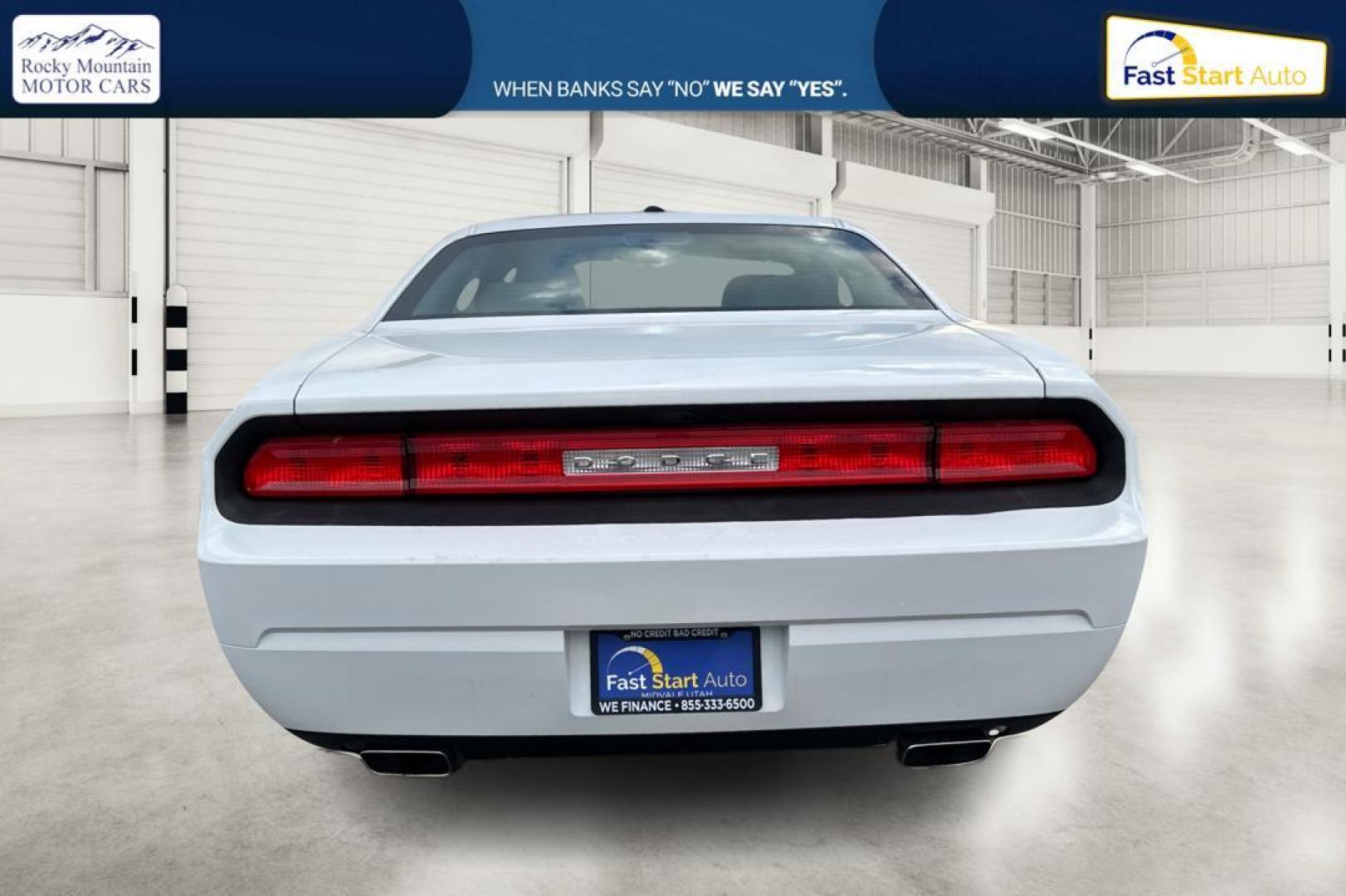 2012 White Dodge Challenger SXT (2C3CDYAG7CH) with an 3.6L V6 DOHC 24V engine, 4-Speed Automatic transmission, located at 344 S Washington Blvd, Ogden, UT, 84404, (801) 399-1799, 41.255482, -111.970848 - Photo#4