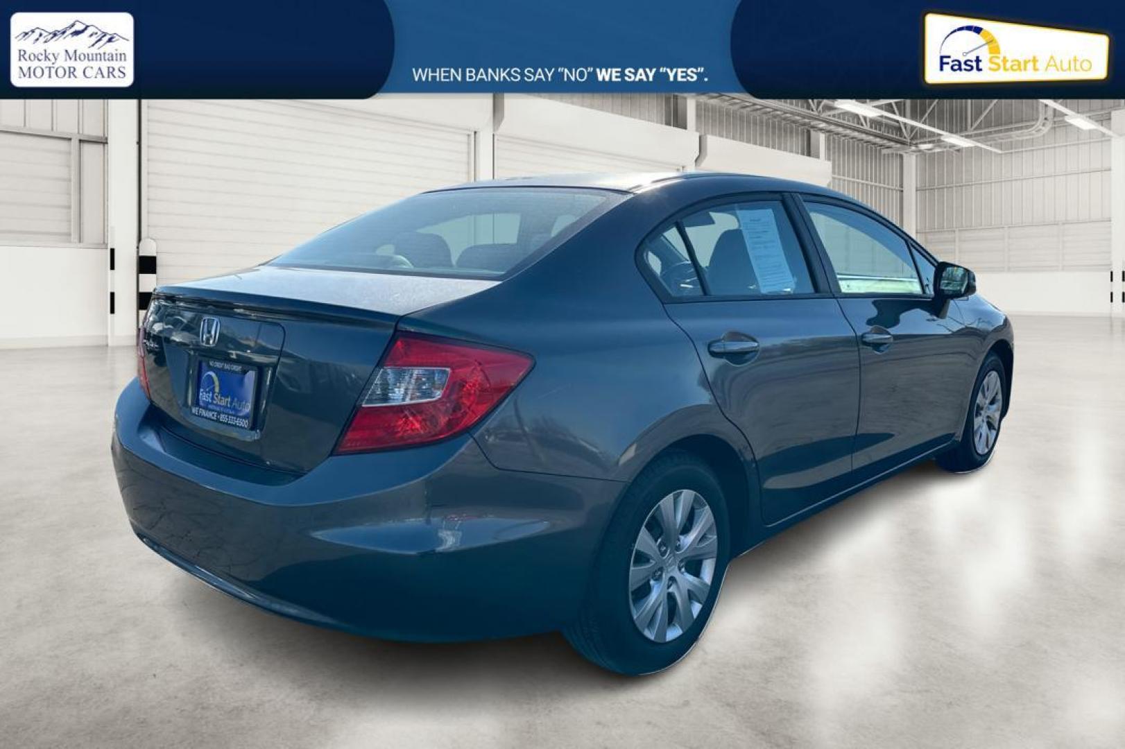 2012 Gray Honda Civic LX Sedan 5-Speed MT (2HGFB2E59CH) with an 1.8L L4 SOHC 16V engine, 5-Speed Manual transmission, located at 344 S Washington Blvd, Ogden, UT, 84404, (801) 399-1799, 41.255482, -111.970848 - Photo#2