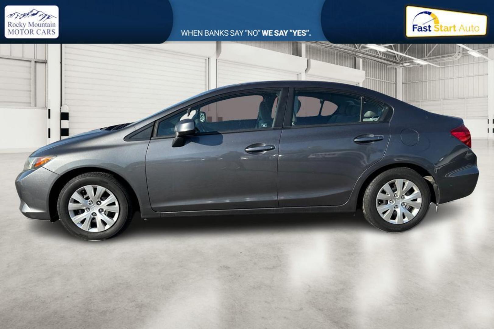 2012 Gray Honda Civic LX Sedan 5-Speed MT (2HGFB2E59CH) with an 1.8L L4 SOHC 16V engine, 5-Speed Manual transmission, located at 344 S Washington Blvd, Ogden, UT, 84404, (801) 399-1799, 41.255482, -111.970848 - Photo#6