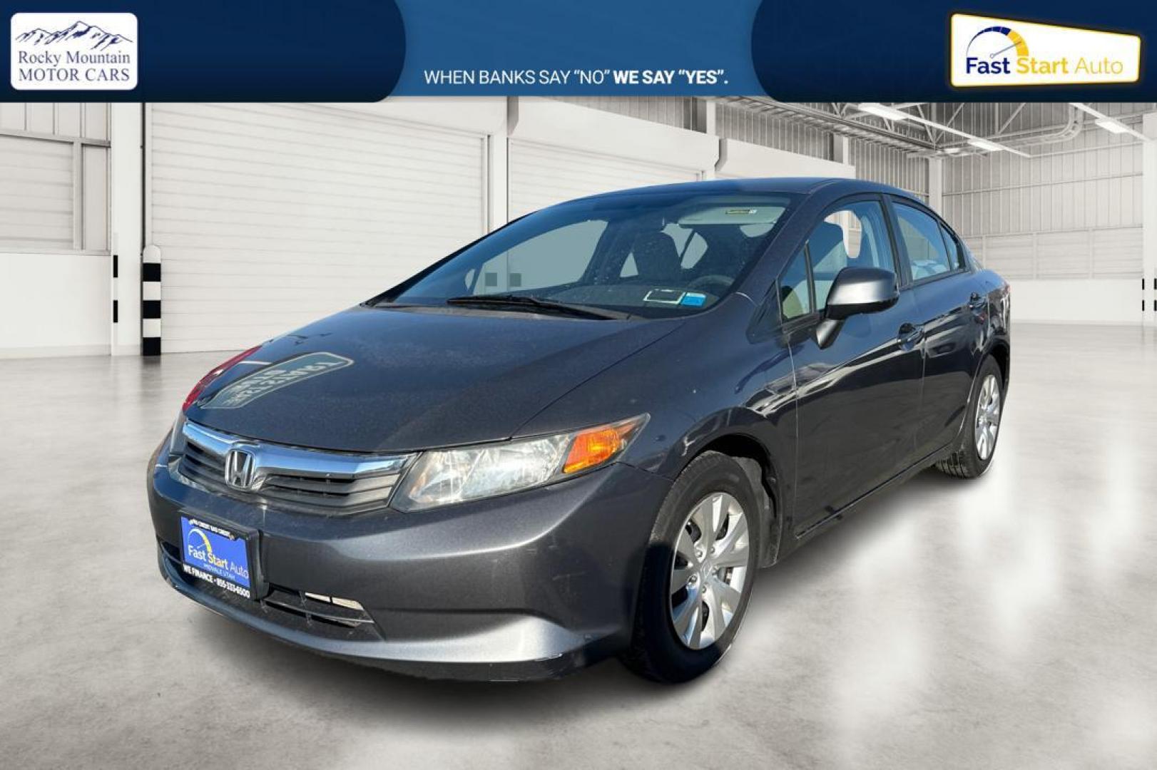 2012 Gray Honda Civic LX Sedan 5-Speed MT (2HGFB2E59CH) with an 1.8L L4 SOHC 16V engine, 5-Speed Manual transmission, located at 344 S Washington Blvd, Ogden, UT, 84404, (801) 399-1799, 41.255482, -111.970848 - Photo#8