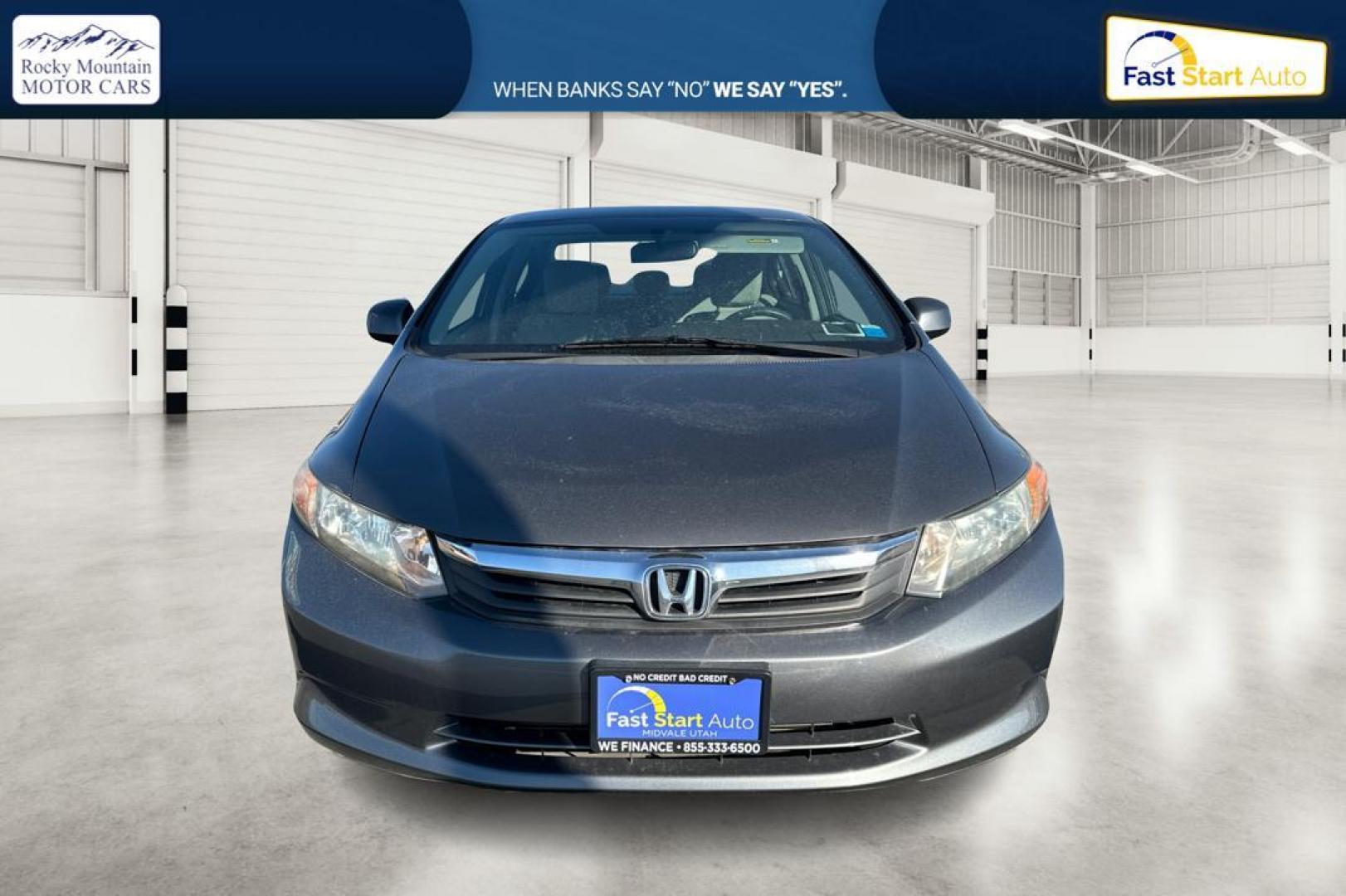 2012 Gray Honda Civic LX Sedan 5-Speed MT (2HGFB2E59CH) with an 1.8L L4 SOHC 16V engine, 5-Speed Manual transmission, located at 344 S Washington Blvd, Ogden, UT, 84404, (801) 399-1799, 41.255482, -111.970848 - Photo#9