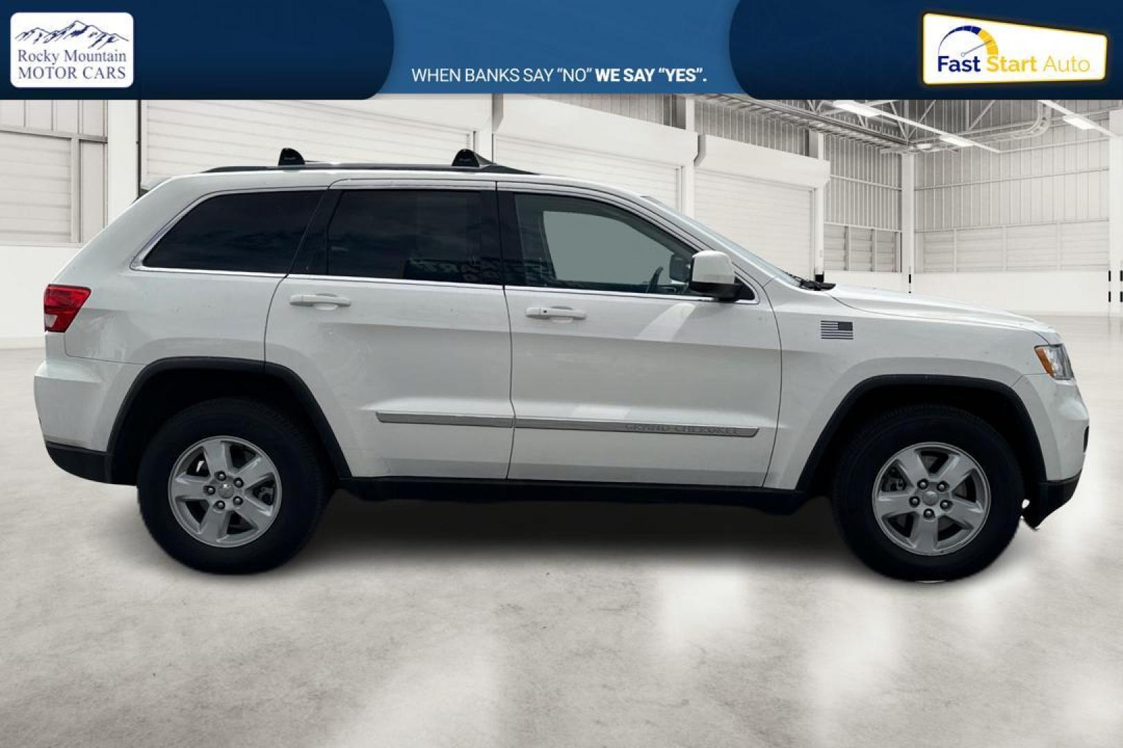 2012 White Jeep Grand Cherokee Laredo 4WD (1C4RJFAG7CC) with an 3.6L V6 DOHC 24V engine, 5-Speed Automatic transmission, located at 7755 State Street, Midvale, UT, 84047, (801) 753-9063, 40.610329, -111.892159 - Photo#1