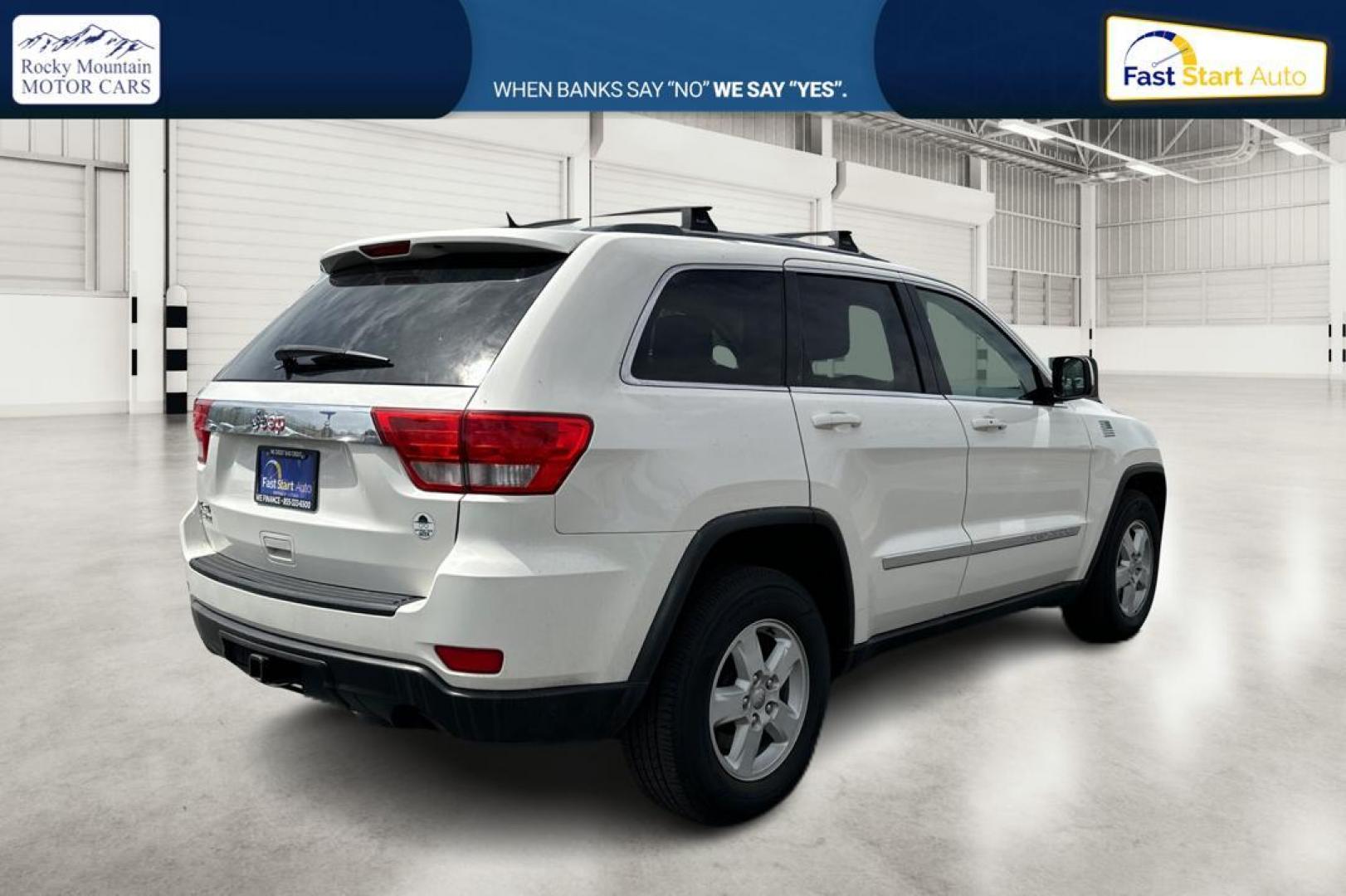 2012 White Jeep Grand Cherokee Laredo 4WD (1C4RJFAG7CC) with an 3.6L V6 DOHC 24V engine, 5-Speed Automatic transmission, located at 7755 State Street, Midvale, UT, 84047, (801) 753-9063, 40.610329, -111.892159 - Photo#2