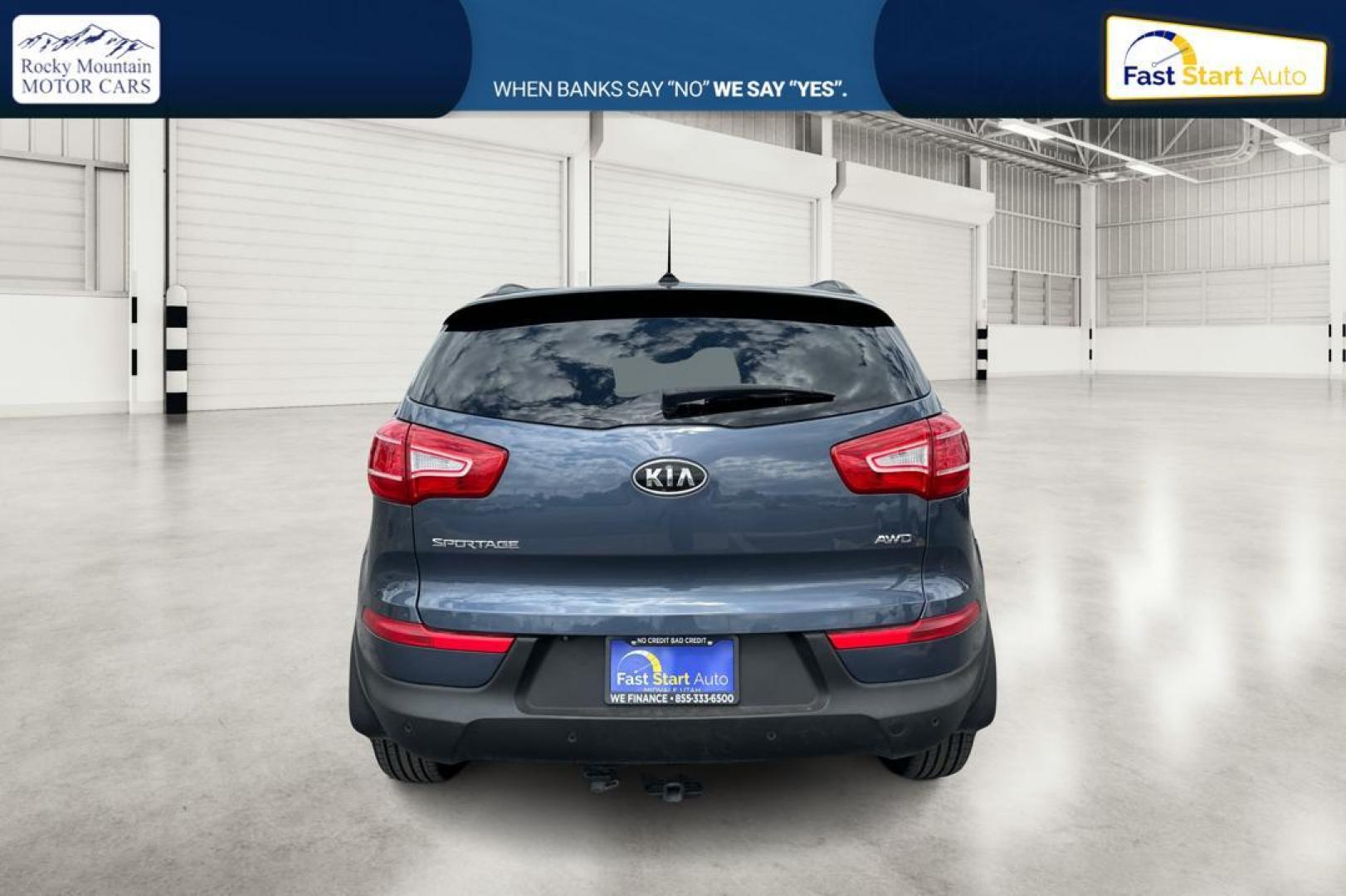 2012 Blue Kia Sportage LX AWD (KNDPBCA22C7) with an 2.4L V6 DOHC 24V engine, 6-Speed Automatic transmission, located at 344 S Washington Blvd, Ogden, UT, 84404, (801) 399-1799, 41.255482, -111.970848 - Photo#3