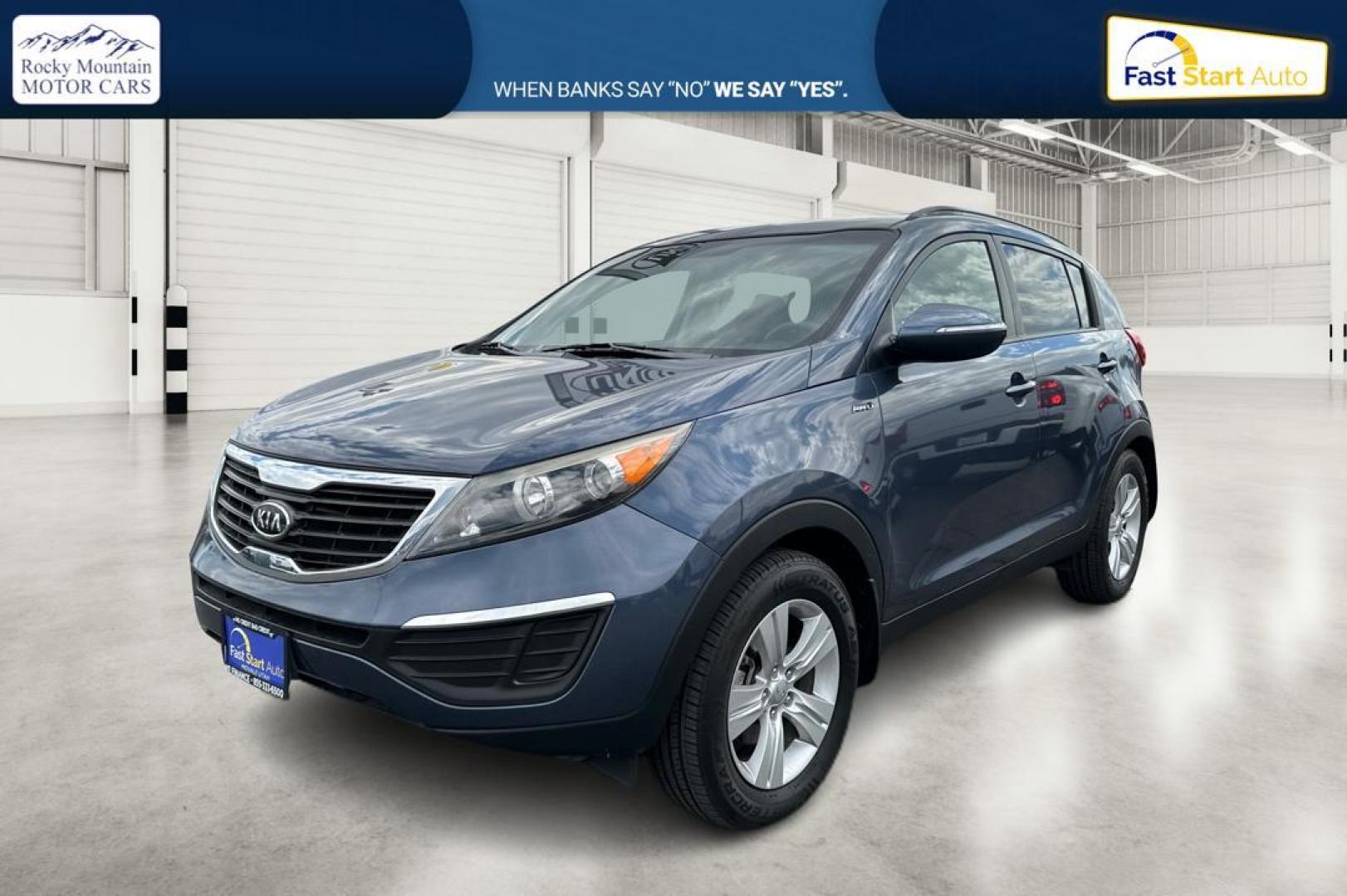 2012 Blue Kia Sportage LX AWD (KNDPBCA22C7) with an 2.4L V6 DOHC 24V engine, 6-Speed Automatic transmission, located at 344 S Washington Blvd, Ogden, UT, 84404, (801) 399-1799, 41.255482, -111.970848 - Photo#6