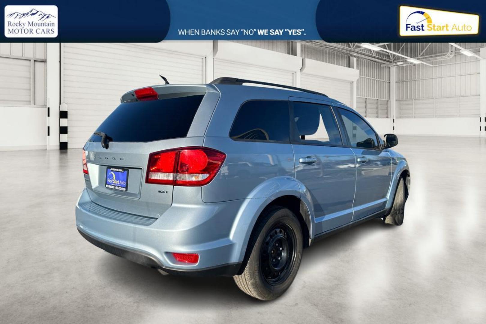 2013 Blue Dodge Journey SXT (3C4PDCBB8DT) with an 2.4L L6 DOHC 16V engine, 4-Speed Automatic transmission, located at 767 S State Road, Pleasant Grove, UT, 84062, (801) 785-1058, 40.354839, -111.736687 - Photo#2