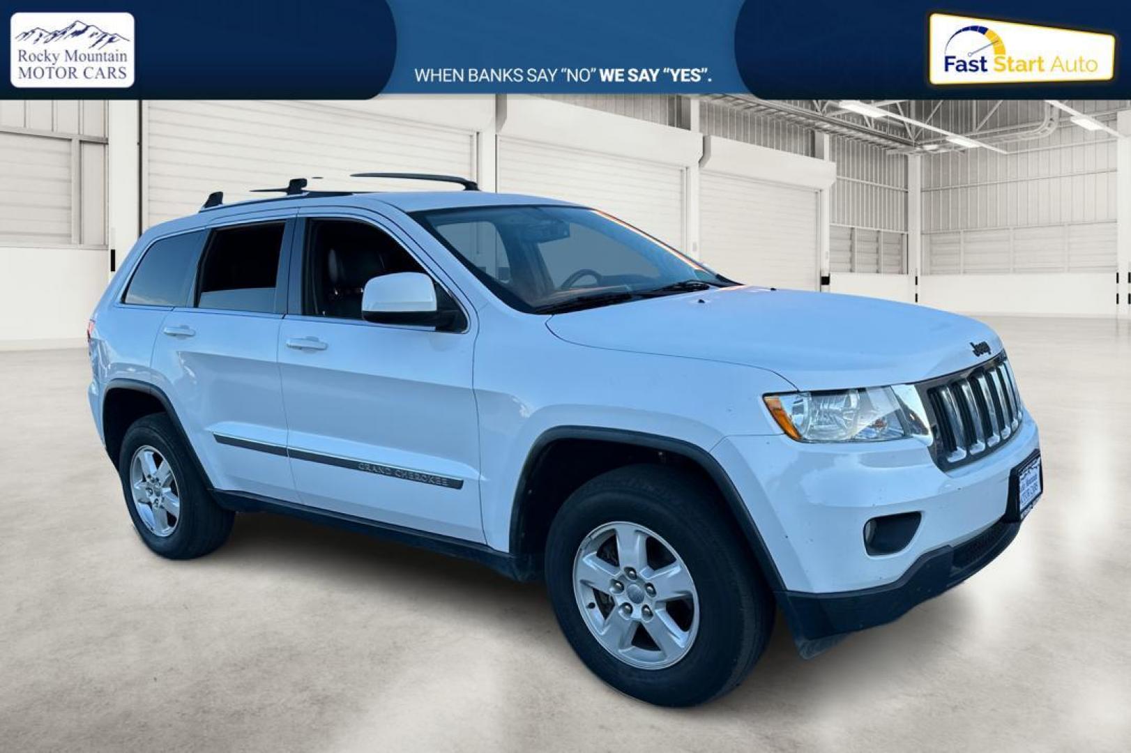 2013 White Jeep Grand Cherokee Laredo 2WD (1C4RJEAG6DC) with an 3.6L V6 DOHC 24V engine, 5-Speed Automatic transmission, located at 344 S Washington Blvd, Ogden, UT, 84404, (801) 399-1799, 41.255482, -111.970848 - Photo#0