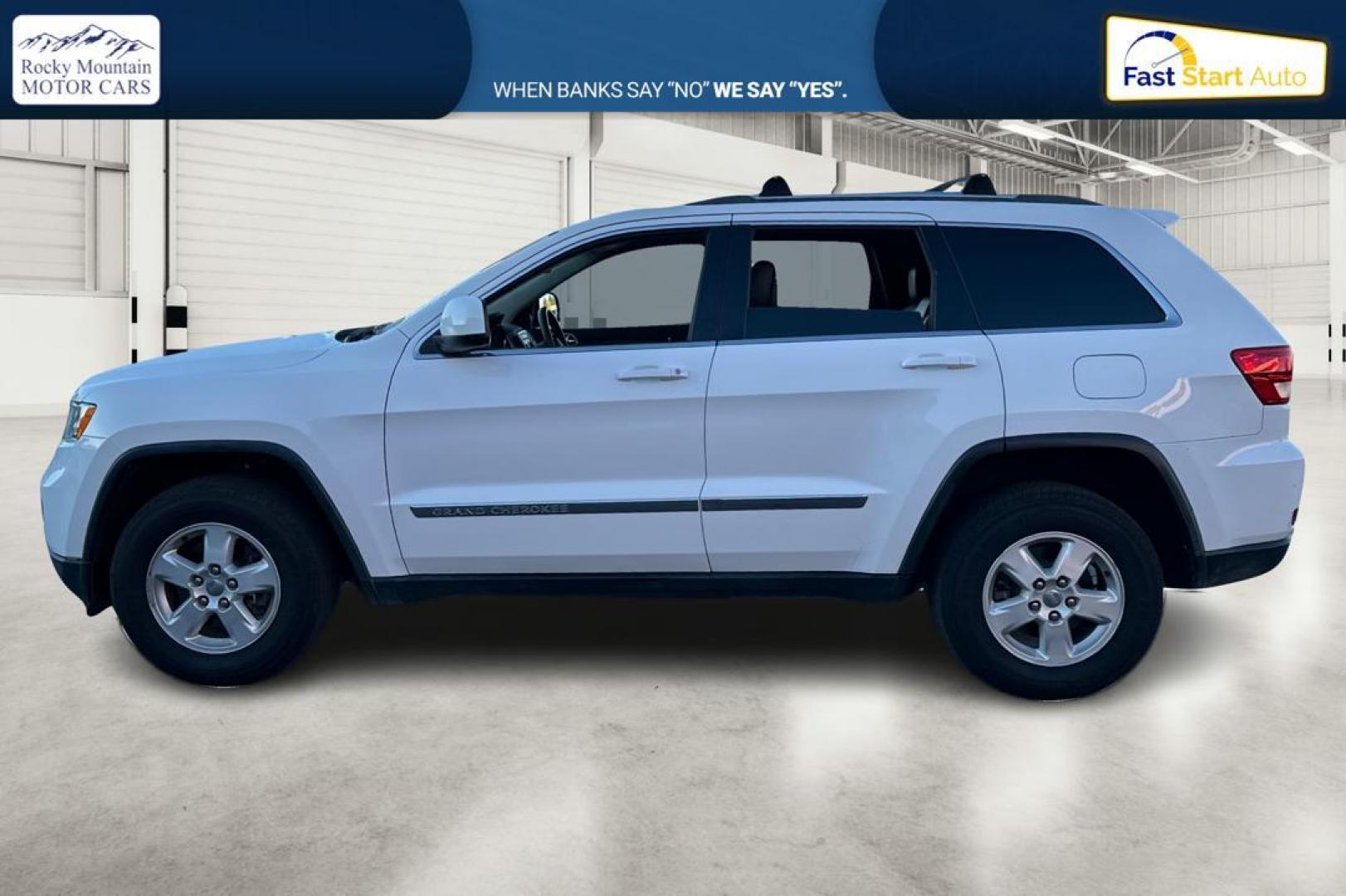 2013 White Jeep Grand Cherokee Laredo 2WD (1C4RJEAG6DC) with an 3.6L V6 DOHC 24V engine, 5-Speed Automatic transmission, located at 344 S Washington Blvd, Ogden, UT, 84404, (801) 399-1799, 41.255482, -111.970848 - Photo#6