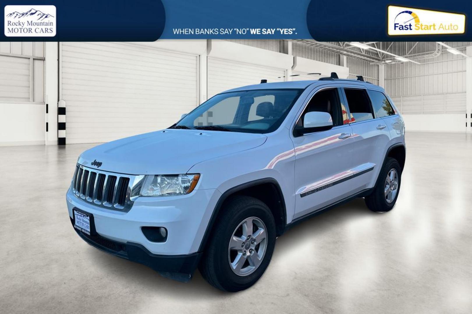 2013 White Jeep Grand Cherokee Laredo 2WD (1C4RJEAG6DC) with an 3.6L V6 DOHC 24V engine, 5-Speed Automatic transmission, located at 344 S Washington Blvd, Ogden, UT, 84404, (801) 399-1799, 41.255482, -111.970848 - Photo#8