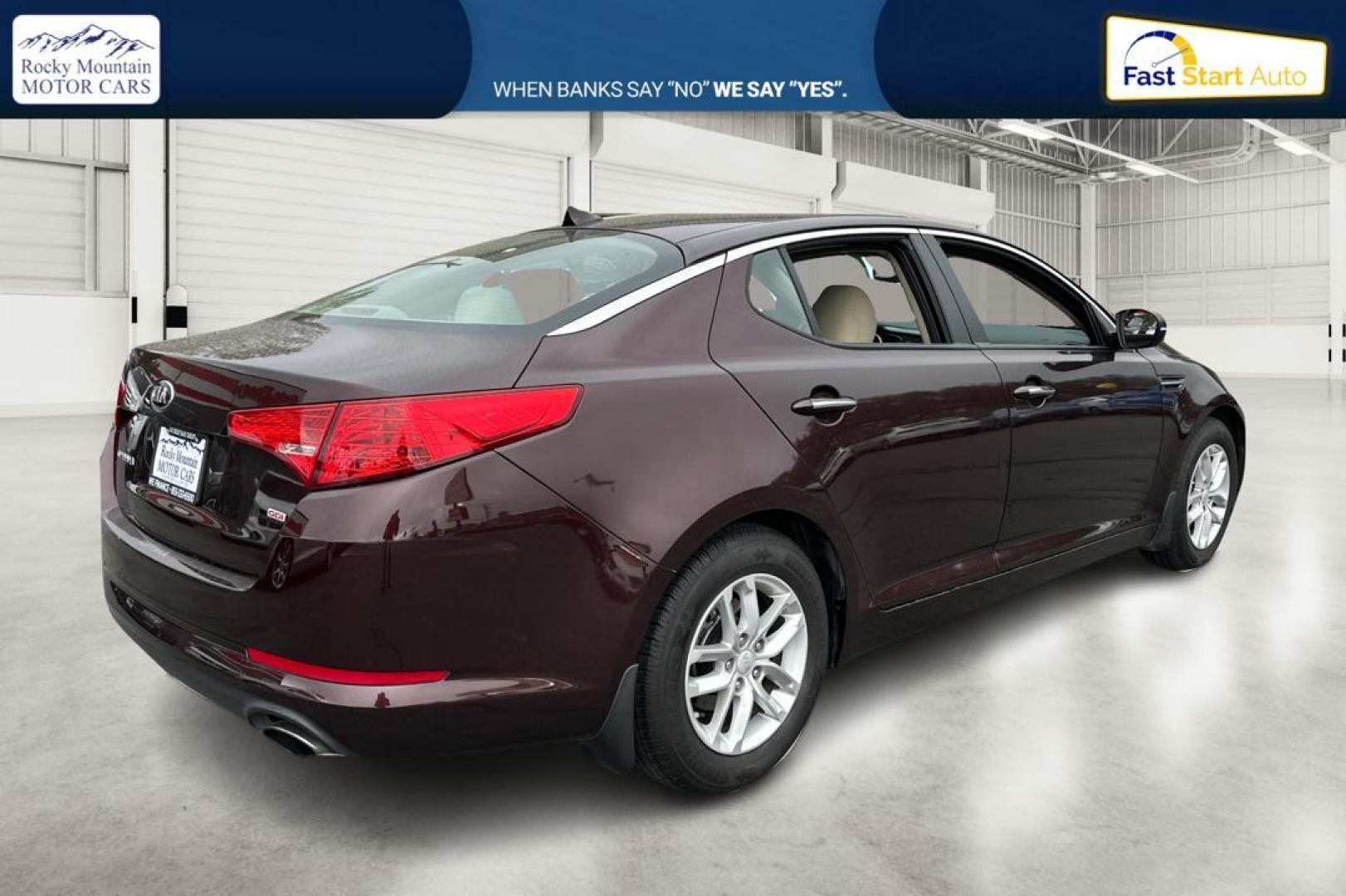 2013 Purple Kia Optima LX MT (5XXGM4A75DG) with an 2.4L L4 DOHC 16V engine, 5-Speed Manual transmission, located at 767 S State Road, Pleasant Grove, UT, 84062, (801) 785-1058, 40.354839, -111.736687 - Photo#2