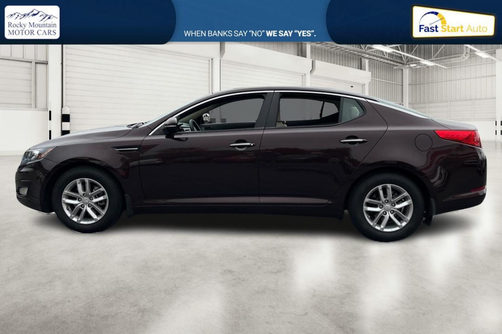 2013 Purple Kia Optima LX MT (5XXGM4A75DG) with an 2.4L L4 DOHC 16V engine, 5-Speed Manual transmission, located at 767 S State Road, Pleasant Grove, UT, 84062, (801) 785-1058, 40.354839, -111.736687 - Photo#6