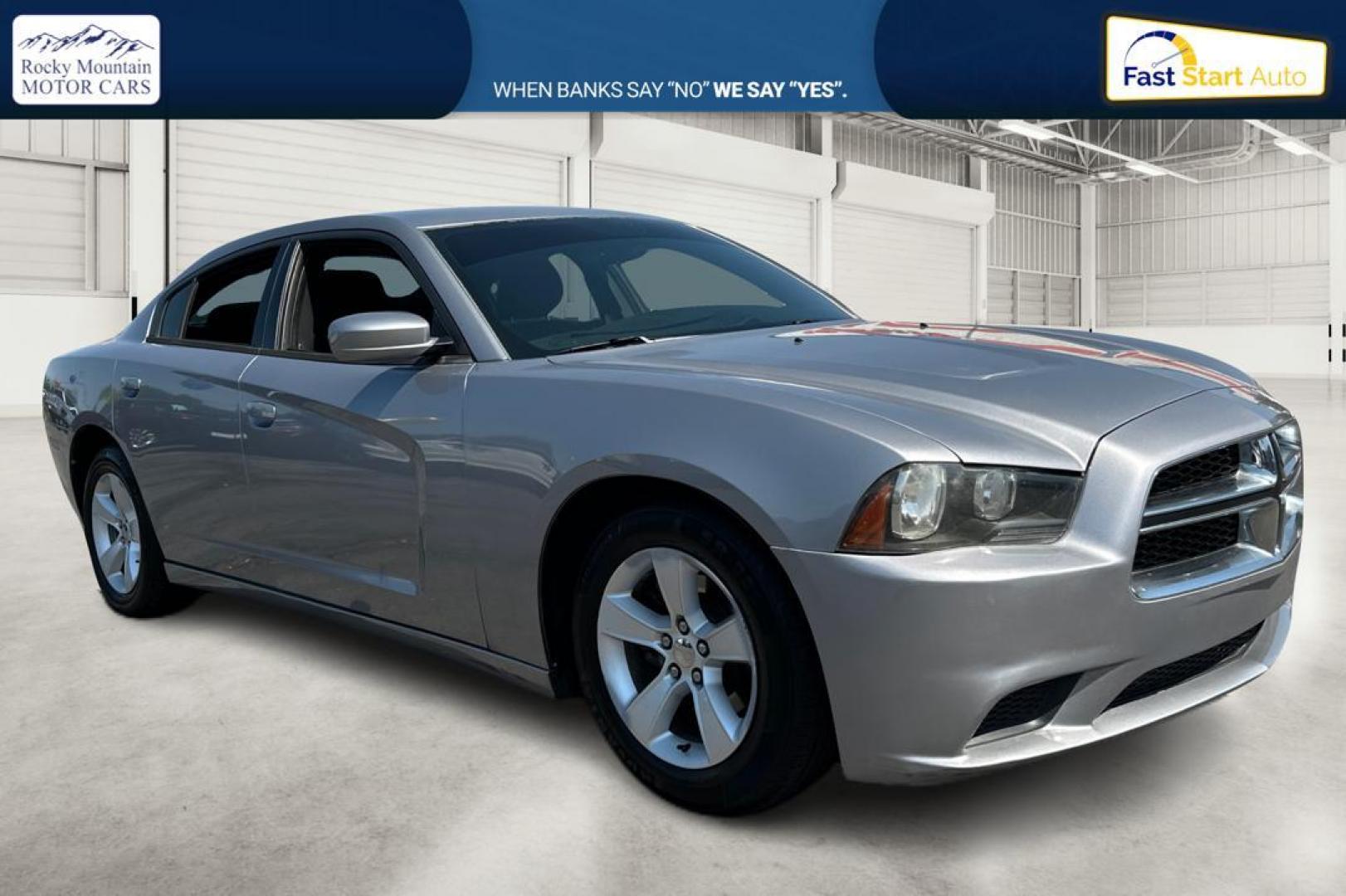 2014 Silver Dodge Charger SE (2C3CDXBG9EH) with an 3.6L V6 DOHC 24V engine, 5-Speed Automatic transmission, located at 767 S State Road, Pleasant Grove, UT, 84062, (801) 785-1058, 40.354839, -111.736687 - Photo#0