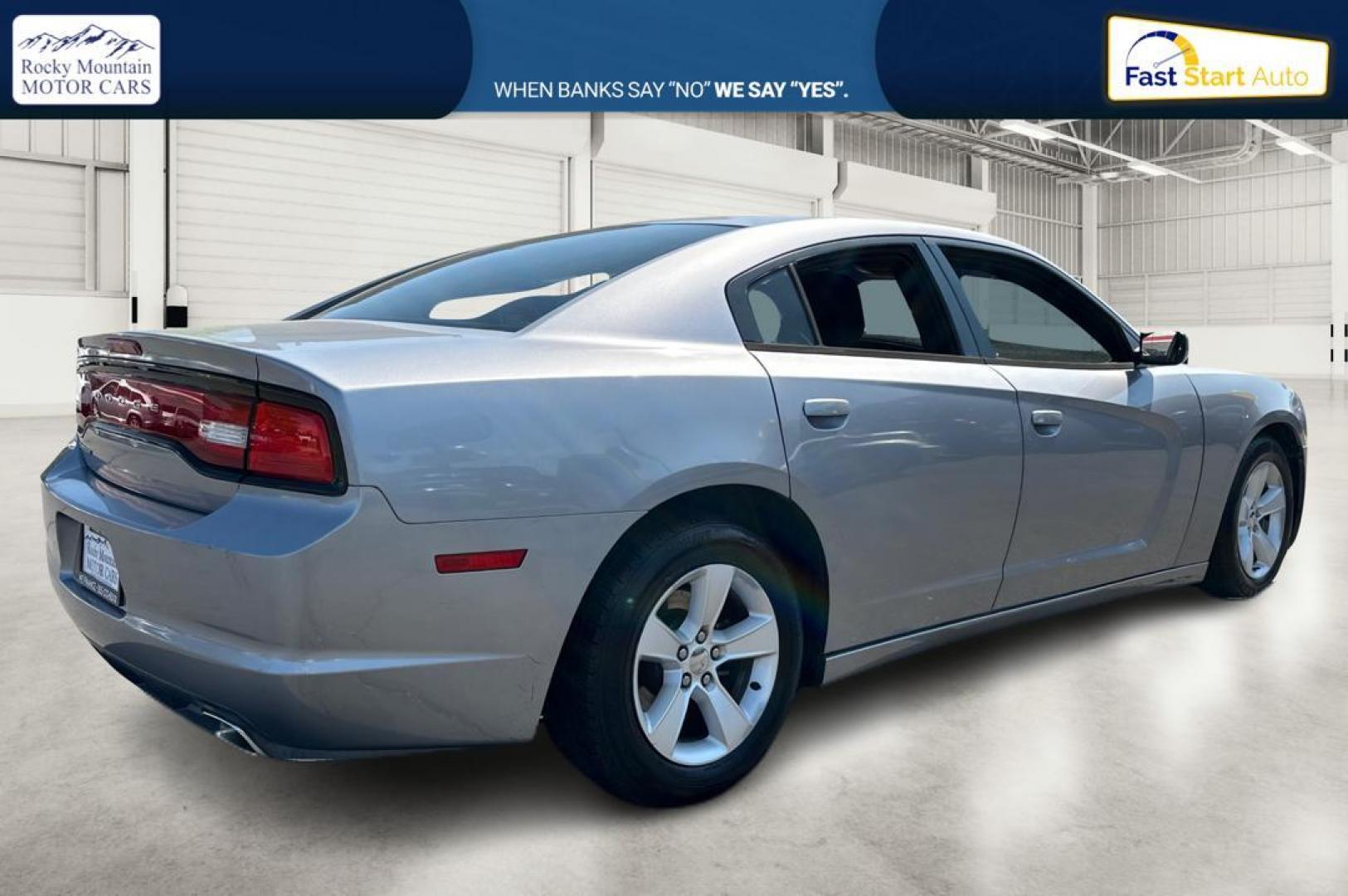 2014 Silver Dodge Charger SE (2C3CDXBG9EH) with an 3.6L V6 DOHC 24V engine, 5-Speed Automatic transmission, located at 767 S State Road, Pleasant Grove, UT, 84062, (801) 785-1058, 40.354839, -111.736687 - Photo#2