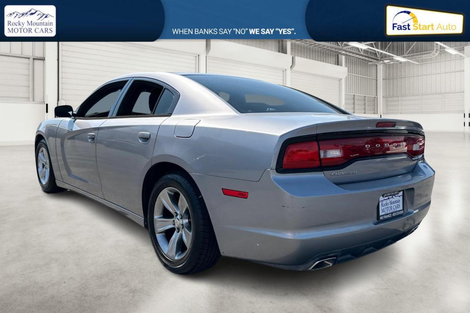 2014 Silver Dodge Charger SE (2C3CDXBG9EH) with an 3.6L V6 DOHC 24V engine, 5-Speed Automatic transmission, located at 767 S State Road, Pleasant Grove, UT, 84062, (801) 785-1058, 40.354839, -111.736687 - Photo#4