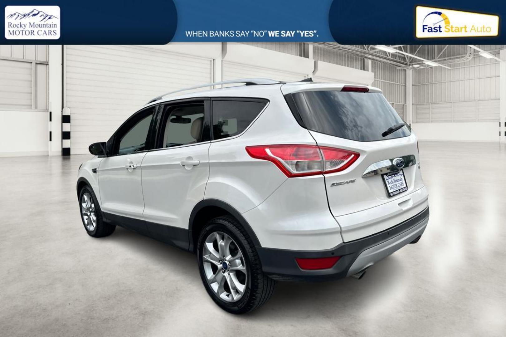 2014 White Ford Escape Titanium FWD (1FMCU0JX5EU) with an 1.6L L4 DOHC 16V engine, 6-Speed Automatic transmission, located at 767 S State Road, Pleasant Grove, UT, 84062, (801) 785-1058, 40.354839, -111.736687 - Photo#4