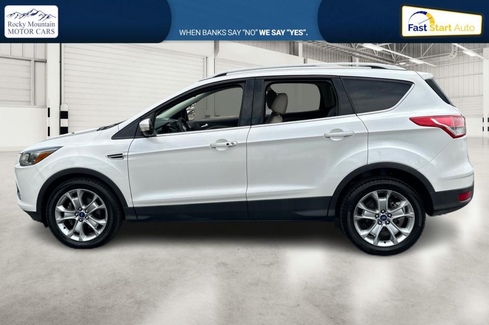 2014 White Ford Escape Titanium FWD (1FMCU0JX5EU) with an 1.6L L4 DOHC 16V engine, 6-Speed Automatic transmission, located at 767 S State Road, Pleasant Grove, UT, 84062, (801) 785-1058, 40.354839, -111.736687 - Photo#5