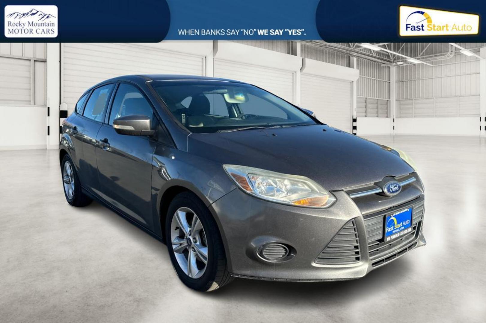 2014 Gray Ford Focus SE Hatch (1FADP3K23EL) with an 2.0L L4 DOHC 16V engine, Auto, 6-Spd Pwr/SelShift transmission, located at 7755 State Street, Midvale, UT, 84047, (801) 753-9063, 40.610329, -111.892159 - Photo#0