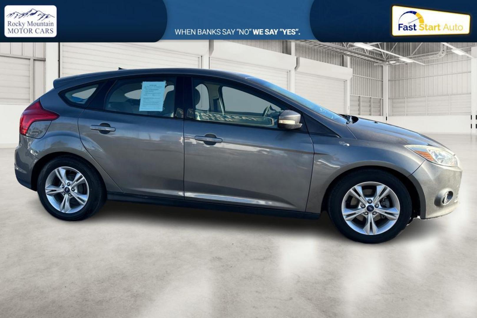 2014 Gray Ford Focus SE Hatch (1FADP3K23EL) with an 2.0L L4 DOHC 16V engine, Auto, 6-Spd Pwr/SelShift transmission, located at 7755 State Street, Midvale, UT, 84047, (801) 753-9063, 40.610329, -111.892159 - Photo#1