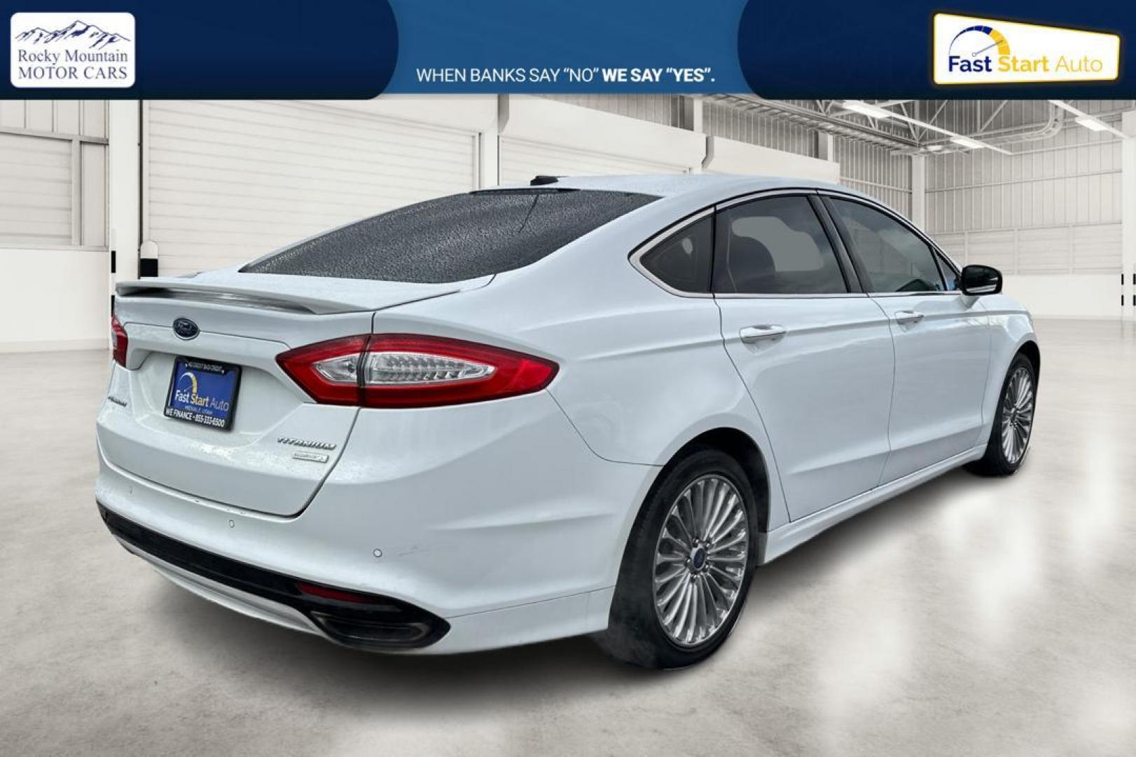 2014 White Ford Fusion Titanium (3FA6P0K93ER) with an 2.0L L4 DOHC 16V engine, Automatic, 6-Spd transmission, located at 7755 State Street, Midvale, UT, 84047, (801) 753-9063, 40.610329, -111.892159 - Photo#2