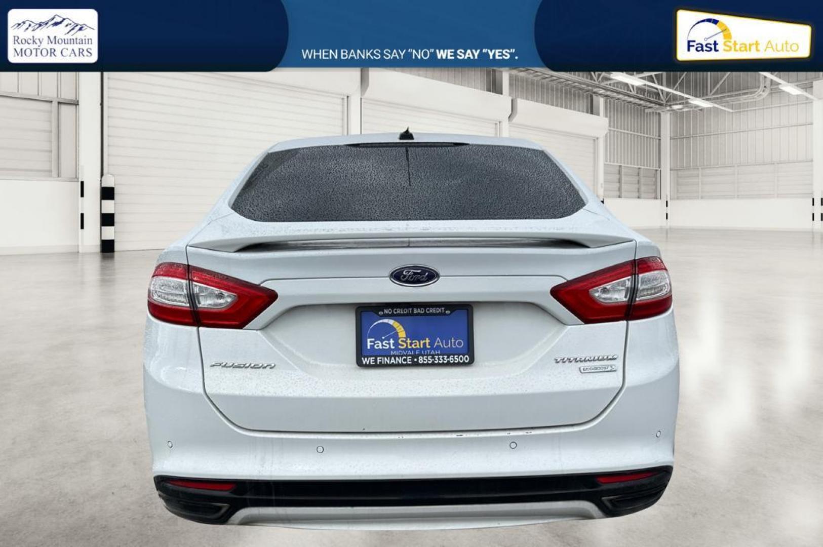 2014 White Ford Fusion Titanium (3FA6P0K93ER) with an 2.0L L4 DOHC 16V engine, Automatic, 6-Spd transmission, located at 7755 State Street, Midvale, UT, 84047, (801) 753-9063, 40.610329, -111.892159 - Photo#4