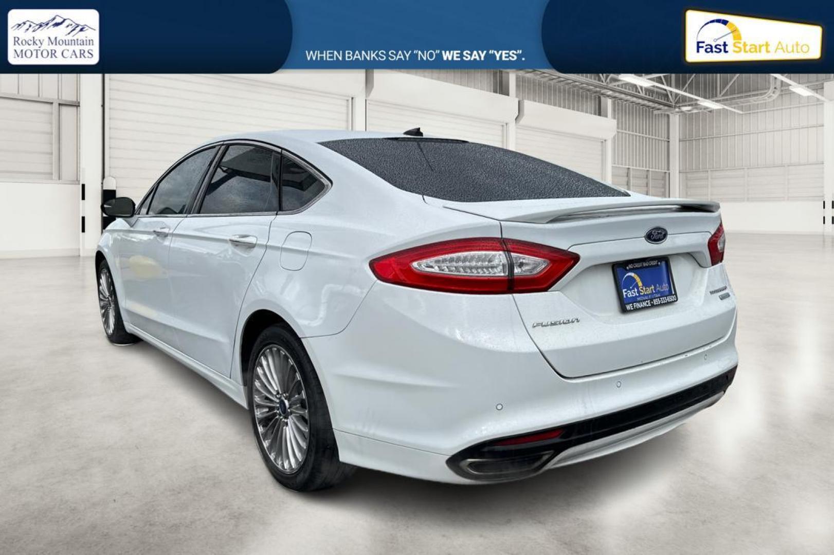 2014 White Ford Fusion Titanium (3FA6P0K93ER) with an 2.0L L4 DOHC 16V engine, Automatic, 6-Spd transmission, located at 7755 State Street, Midvale, UT, 84047, (801) 753-9063, 40.610329, -111.892159 - Photo#5