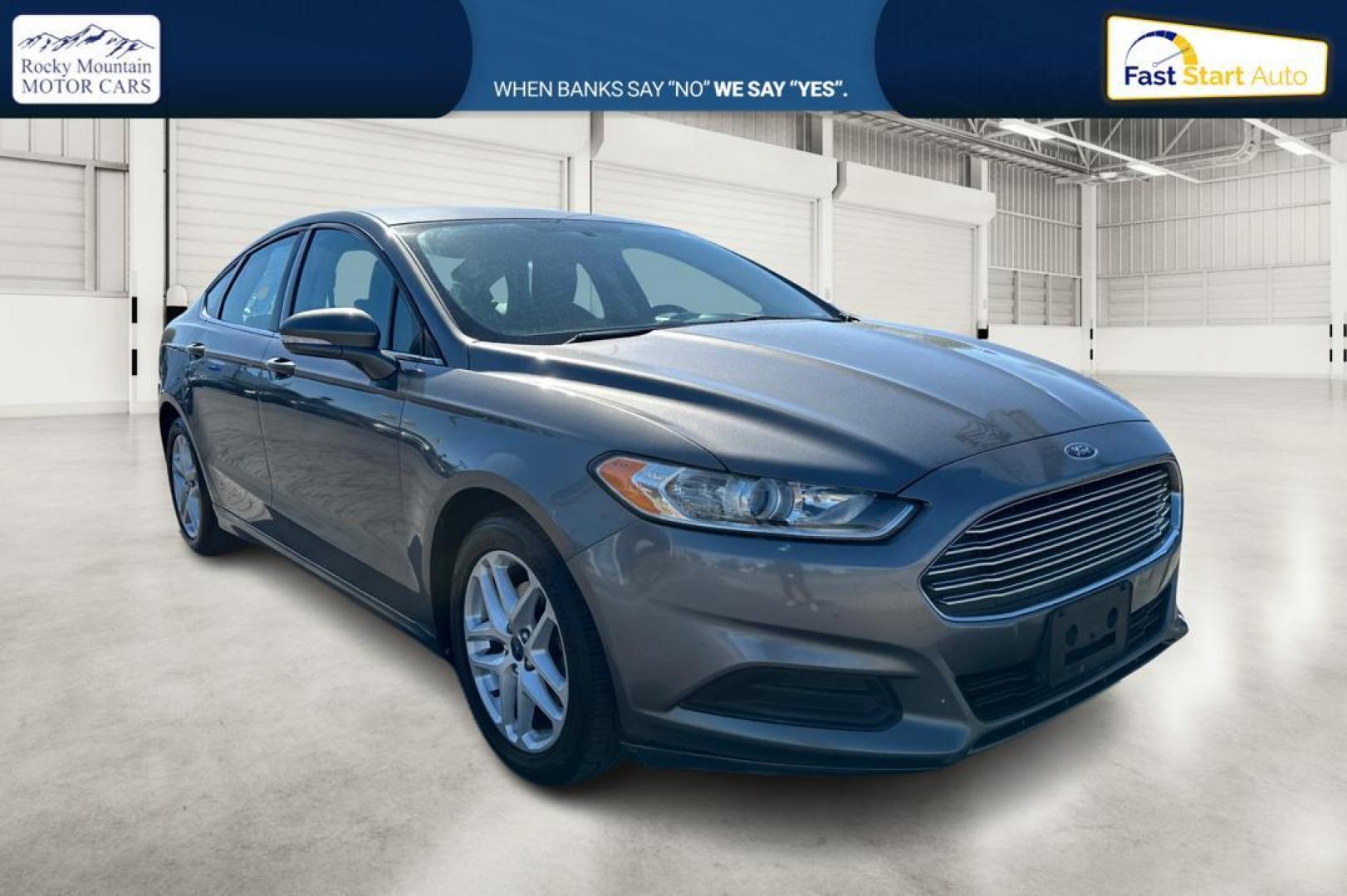 2014 Gray Ford Fusion SE (3FA6P0H74ER) with an 2.5L L4 DOHC 16V engine, Automatic, 6-Spd transmission, located at 344 S Washington Blvd, Ogden, UT, 84404, (801) 399-1799, 41.255482, -111.970848 - Photo#0