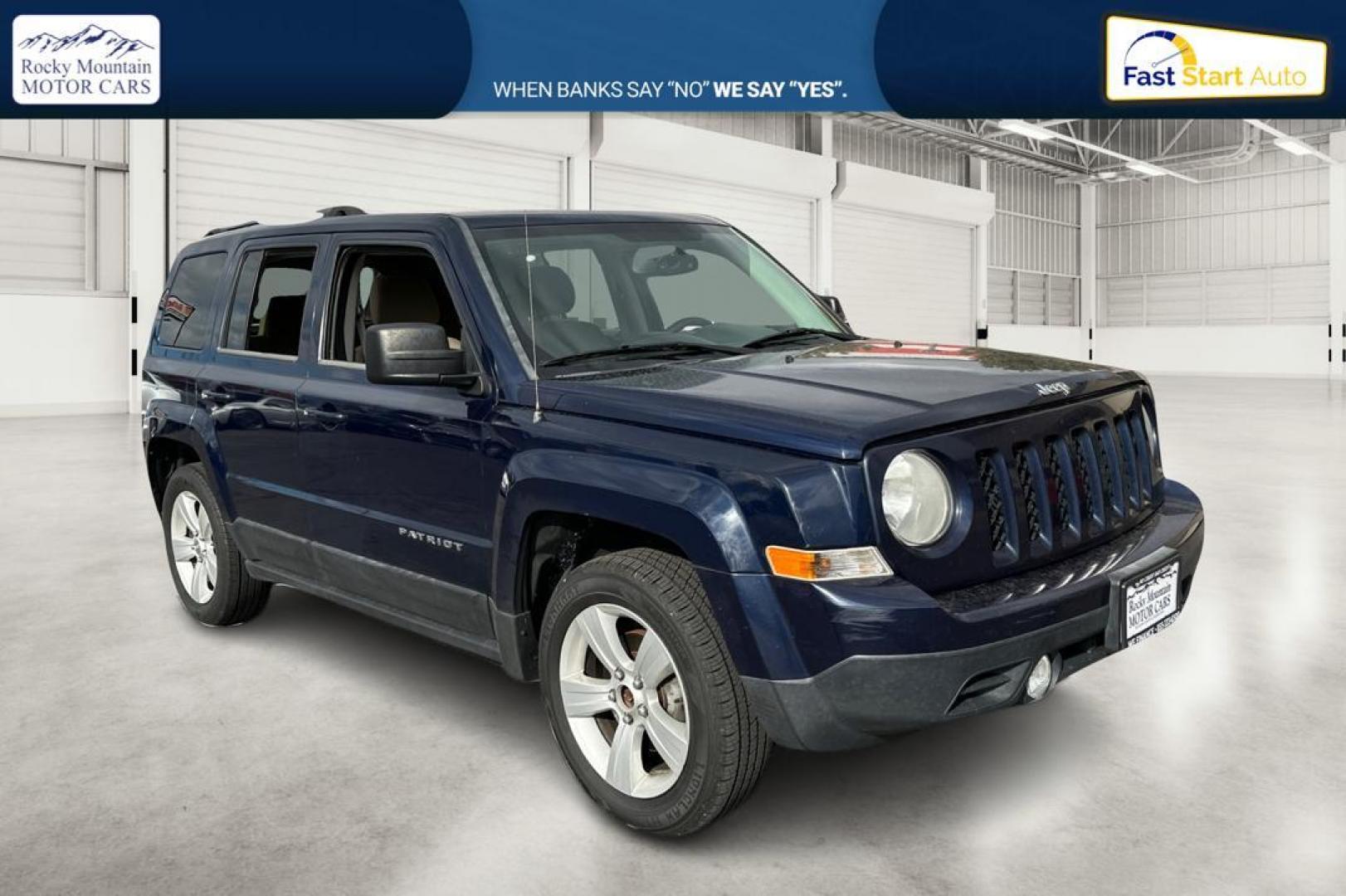 2014 Blue Jeep Patriot Latitude 2WD (1C4NJPFA5ED) with an 2.0L L4 DOHC 16V engine, Automatic, 6-Spd w/AutoStick transmission, located at 344 S Washington Blvd, Ogden, UT, 84404, (801) 399-1799, 41.255482, -111.970848 - Photo#0