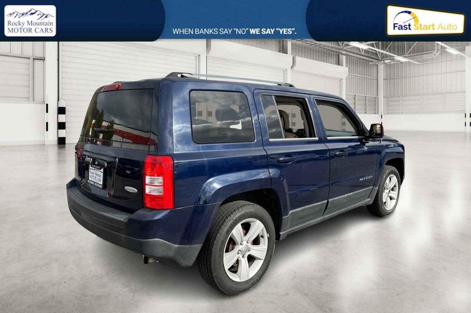 2014 Blue Jeep Patriot Latitude 2WD (1C4NJPFA5ED) with an 2.0L L4 DOHC 16V engine, Automatic, 6-Spd w/AutoStick transmission, located at 344 S Washington Blvd, Ogden, UT, 84404, (801) 399-1799, 41.255482, -111.970848 - Photo#2