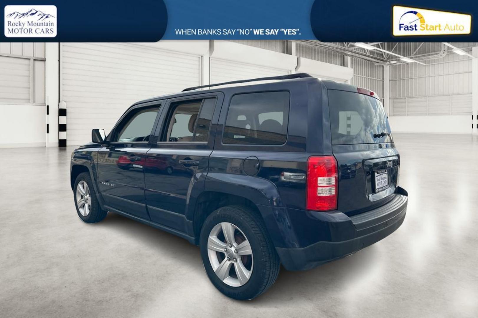 2014 Blue Jeep Patriot Latitude 2WD (1C4NJPFA5ED) with an 2.0L L4 DOHC 16V engine, Automatic, 6-Spd w/AutoStick transmission, located at 344 S Washington Blvd, Ogden, UT, 84404, (801) 399-1799, 41.255482, -111.970848 - Photo#5