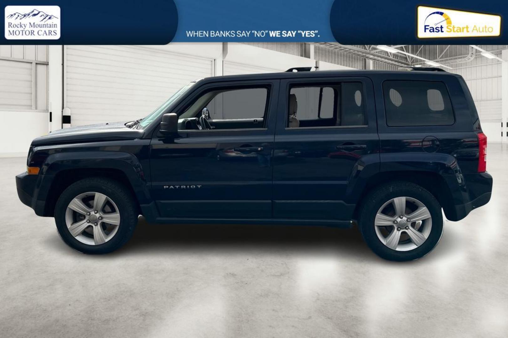 2014 Blue Jeep Patriot Latitude 2WD (1C4NJPFA5ED) with an 2.0L L4 DOHC 16V engine, Automatic, 6-Spd w/AutoStick transmission, located at 344 S Washington Blvd, Ogden, UT, 84404, (801) 399-1799, 41.255482, -111.970848 - Photo#6