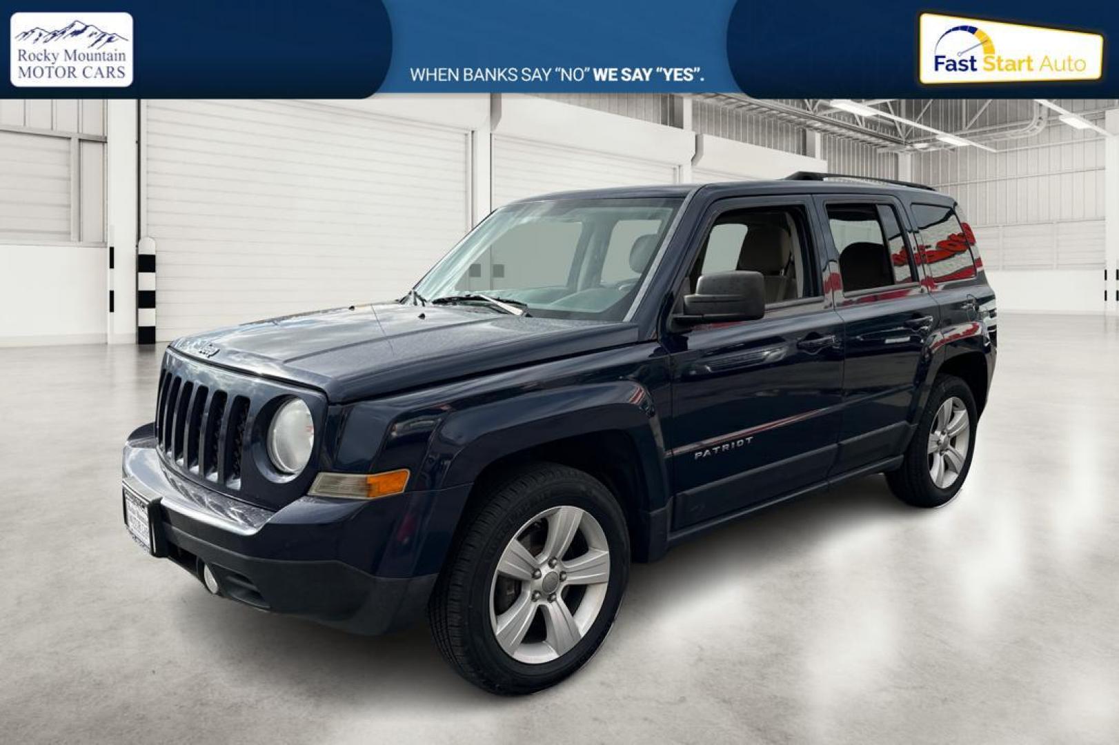 2014 Blue Jeep Patriot Latitude 2WD (1C4NJPFA5ED) with an 2.0L L4 DOHC 16V engine, Automatic, 6-Spd w/AutoStick transmission, located at 344 S Washington Blvd, Ogden, UT, 84404, (801) 399-1799, 41.255482, -111.970848 - Photo#8