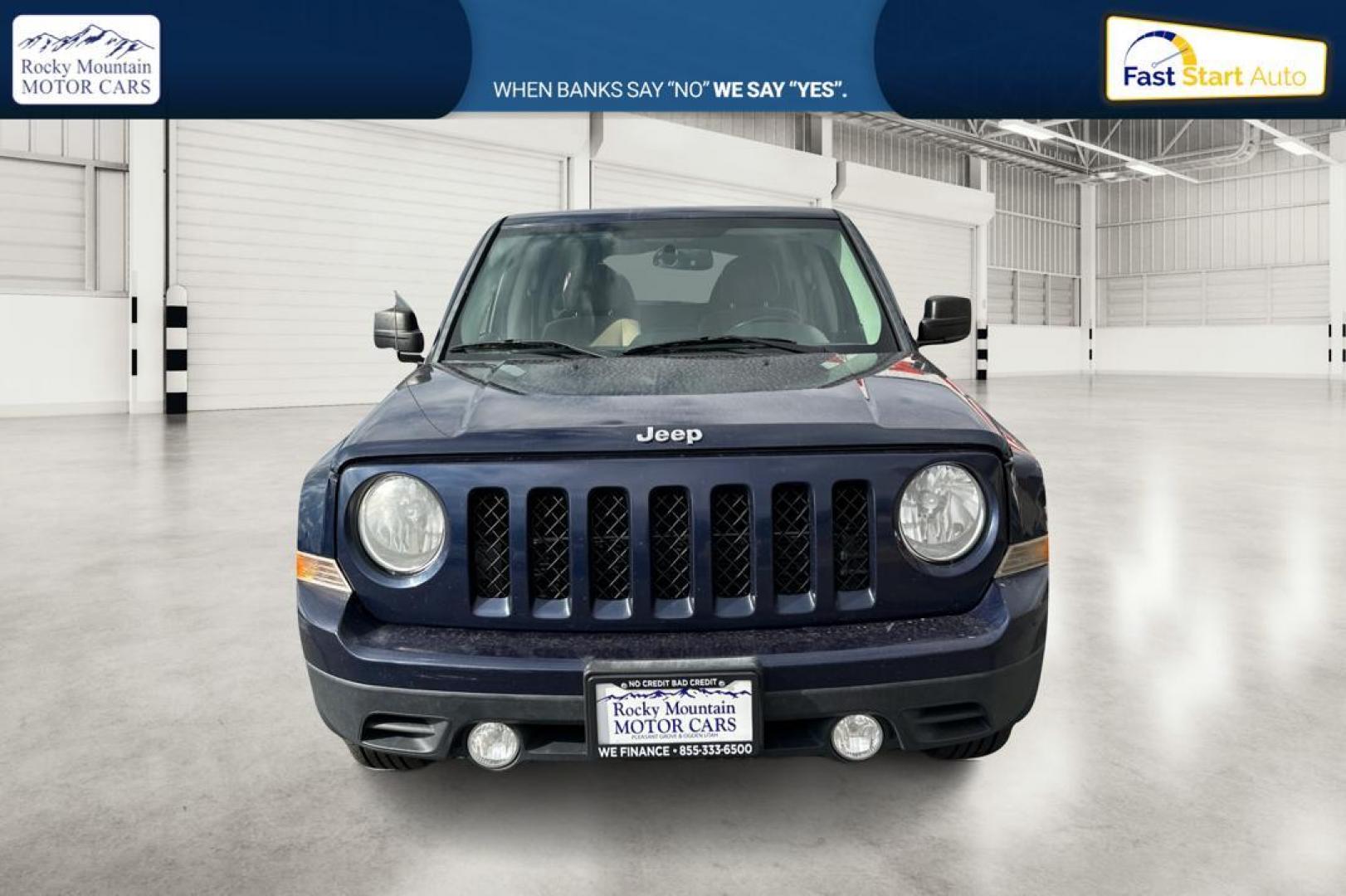 2014 Blue Jeep Patriot Latitude 2WD (1C4NJPFA5ED) with an 2.0L L4 DOHC 16V engine, Automatic, 6-Spd w/AutoStick transmission, located at 344 S Washington Blvd, Ogden, UT, 84404, (801) 399-1799, 41.255482, -111.970848 - Photo#9