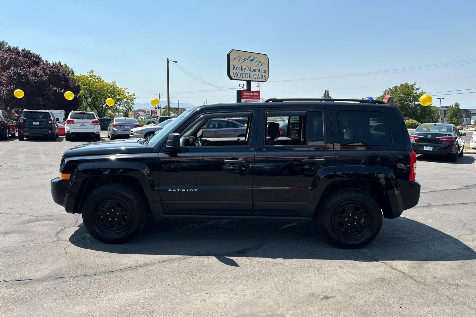 2014 Black Jeep Patriot Sport 2WD (1C4NJPBA2ED) with an 2.0L L4 DOHC 16V engine, Automatic, 6-Spd w/AutoStick transmission, located at 344 S Washington Blvd, Ogden, UT, 84404, (801) 399-1799, 41.255482, -111.970848 - Photo#5