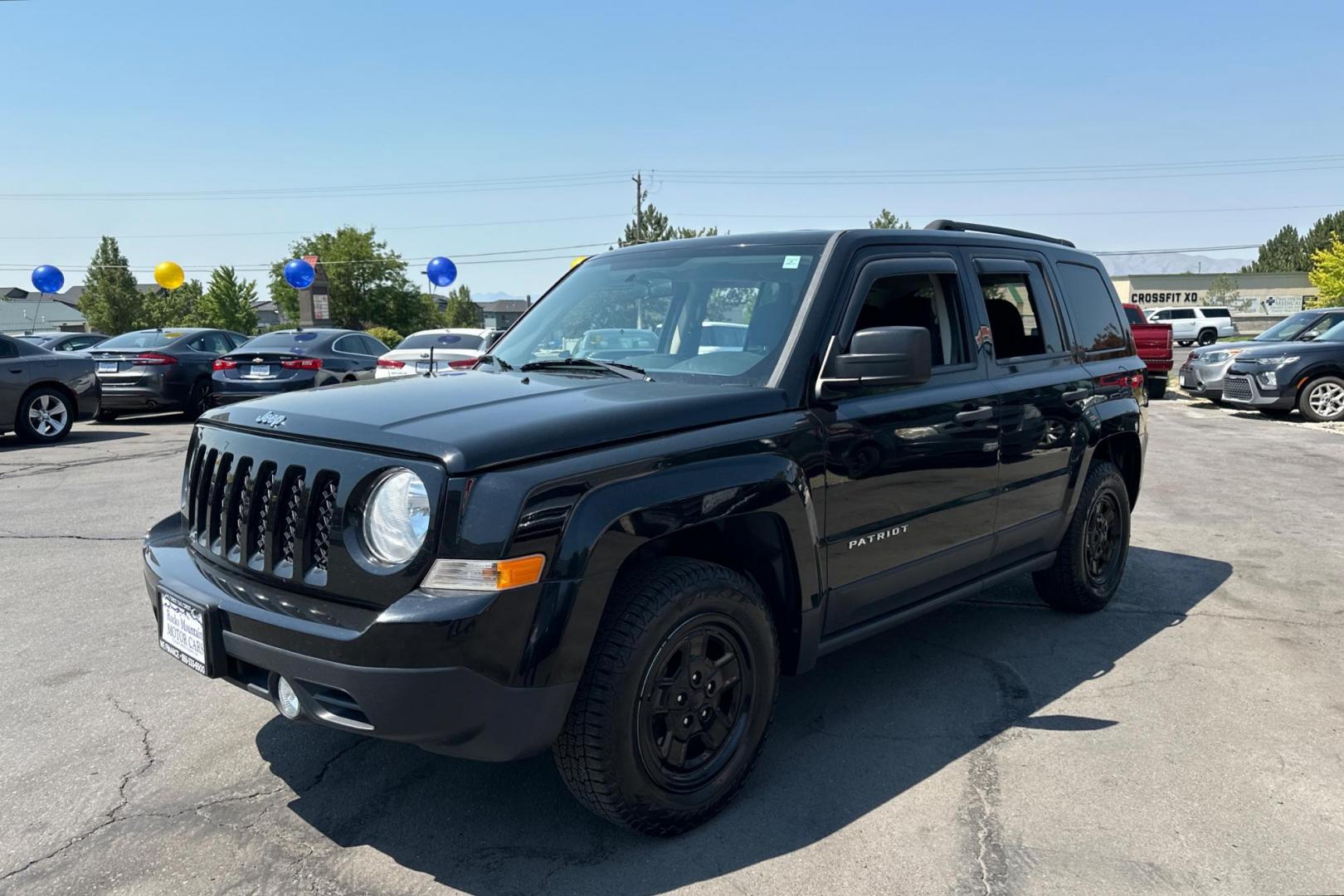 2014 Black Jeep Patriot Sport 2WD (1C4NJPBA2ED) with an 2.0L L4 DOHC 16V engine, Automatic, 6-Spd w/AutoStick transmission, located at 344 S Washington Blvd, Ogden, UT, 84404, (801) 399-1799, 41.255482, -111.970848 - Photo#6