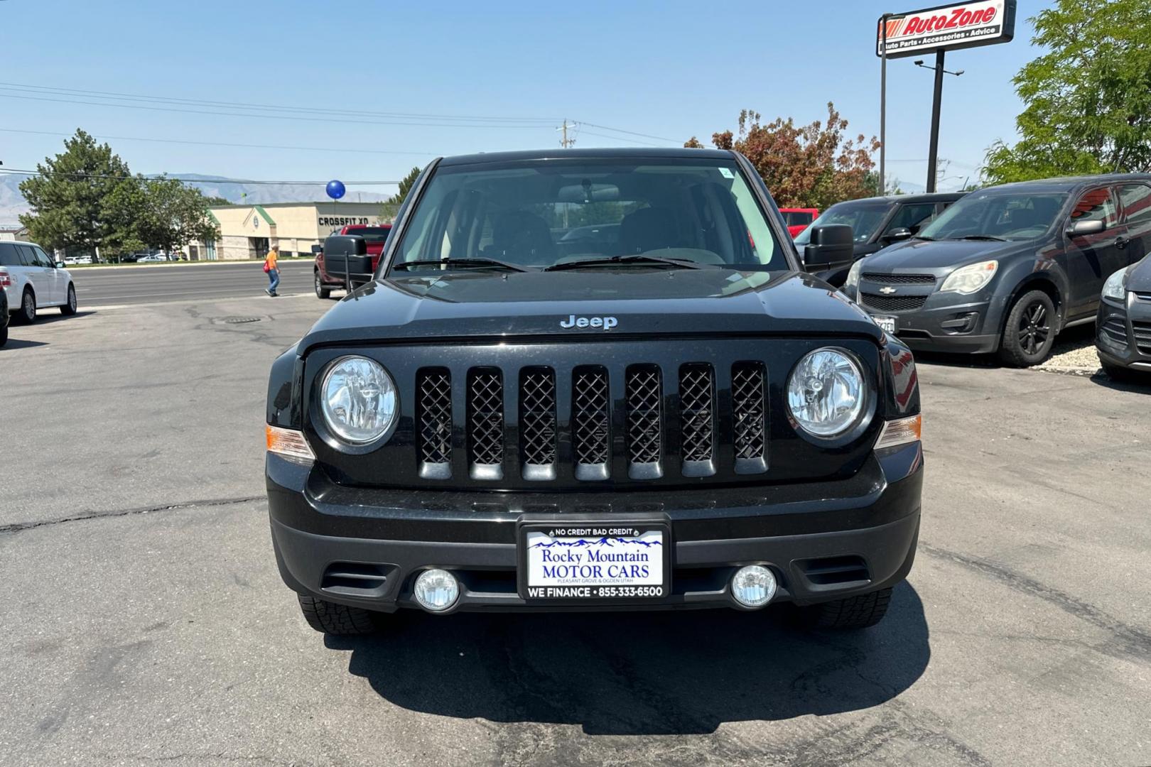 2014 Black Jeep Patriot Sport 2WD (1C4NJPBA2ED) with an 2.0L L4 DOHC 16V engine, Automatic, 6-Spd w/AutoStick transmission, located at 344 S Washington Blvd, Ogden, UT, 84404, (801) 399-1799, 41.255482, -111.970848 - Photo#7