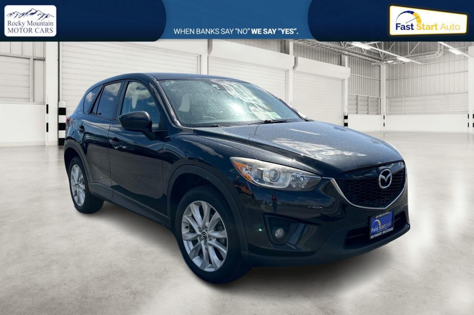 2014 Black Mazda CX-5 Grand Touring AWD (JM3KE4DY8E0) with an 2.5L L4 DOHC 16V engine, 6-Speed Automatic transmission, located at 344 S Washington Blvd, Ogden, UT, 84404, (801) 399-1799, 41.255482, -111.970848 - Photo#0