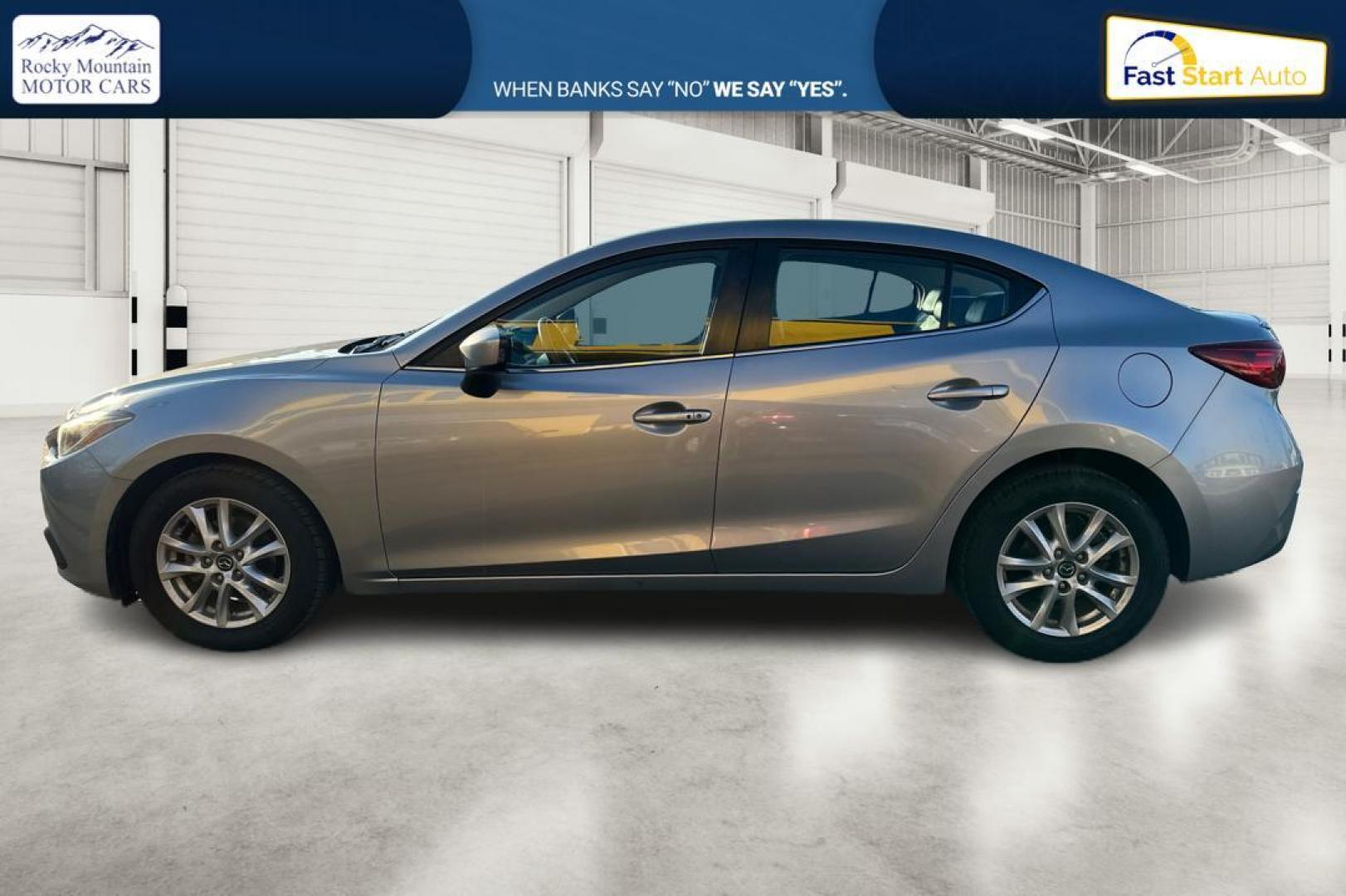 2014 Silver Mazda MAZDA3 i Grand Touring AT 4-Door (JM1BM1W76E1) with an 2.0L L4 DOHC 16V engine, 6-Speed Automatic transmission, located at 344 S Washington Blvd, Ogden, UT, 84404, (801) 399-1799, 41.255482, -111.970848 - Photo#5