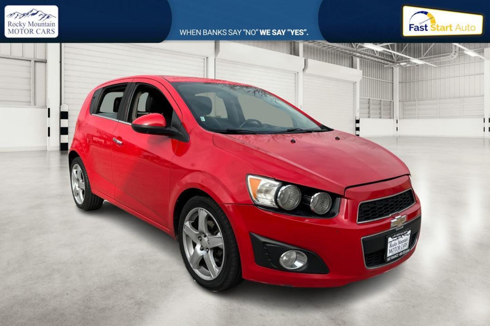 2015 Red Chevrolet Sonic LTZ Auto 5-Door (1G1JE6SB1F4) with an 1.4L L4 DOHC 24V TURBO engine, 6-Speed Automatic transmission, located at 767 S State Road, Pleasant Grove, UT, 84062, (801) 785-1058, 40.354839, -111.736687 - Photo#0