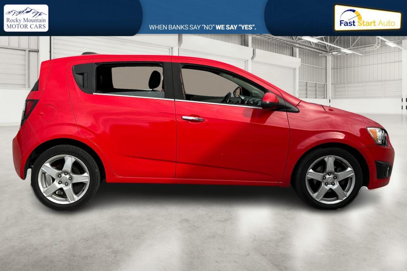 2015 Red Chevrolet Sonic LTZ Auto 5-Door (1G1JE6SB1F4) with an 1.4L L4 DOHC 24V TURBO engine, 6-Speed Automatic transmission, located at 767 S State Road, Pleasant Grove, UT, 84062, (801) 785-1058, 40.354839, -111.736687 - Photo#1