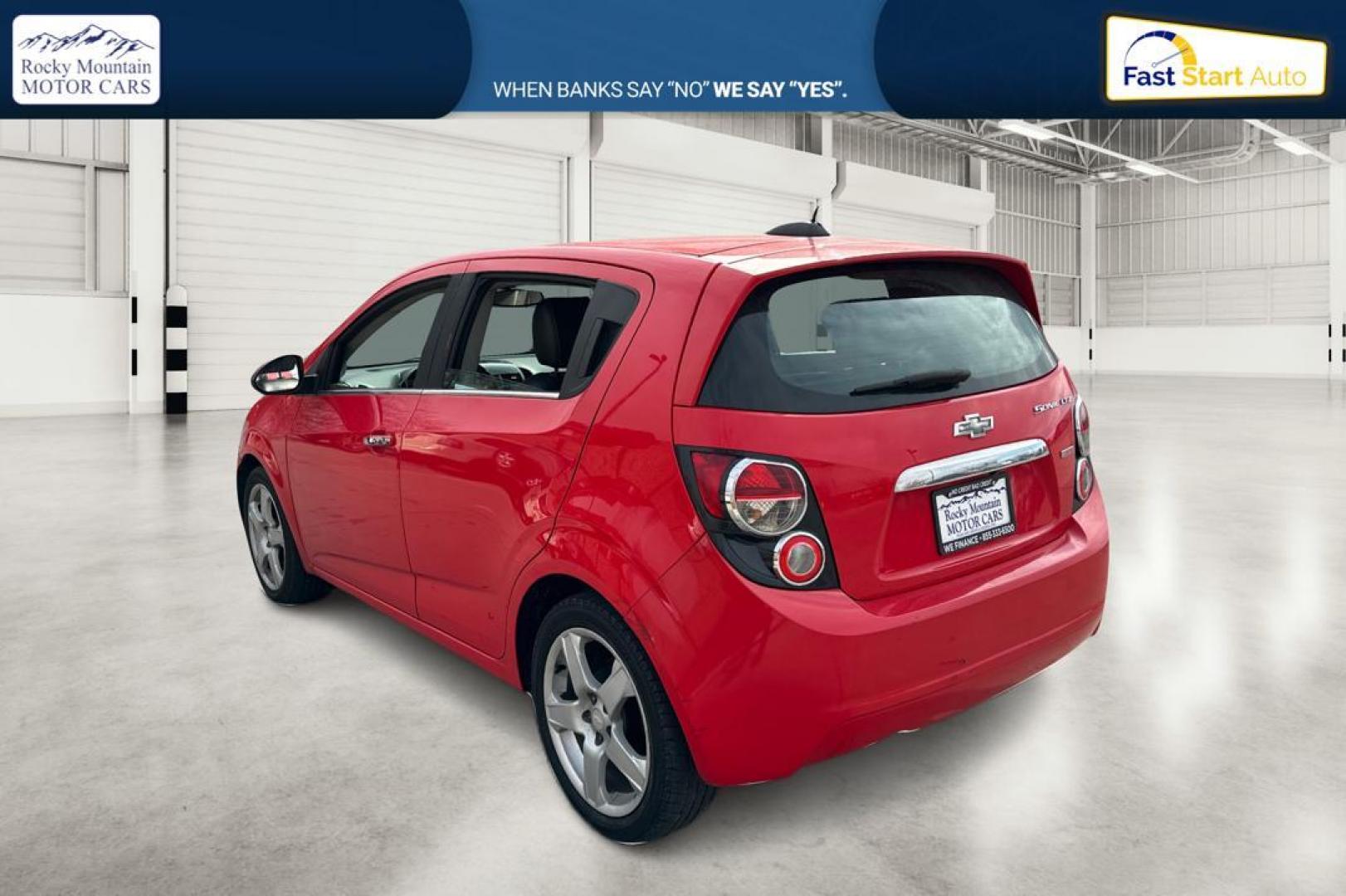 2015 Red Chevrolet Sonic LTZ Auto 5-Door (1G1JE6SB1F4) with an 1.4L L4 DOHC 24V TURBO engine, 6-Speed Automatic transmission, located at 767 S State Road, Pleasant Grove, UT, 84062, (801) 785-1058, 40.354839, -111.736687 - Photo#5