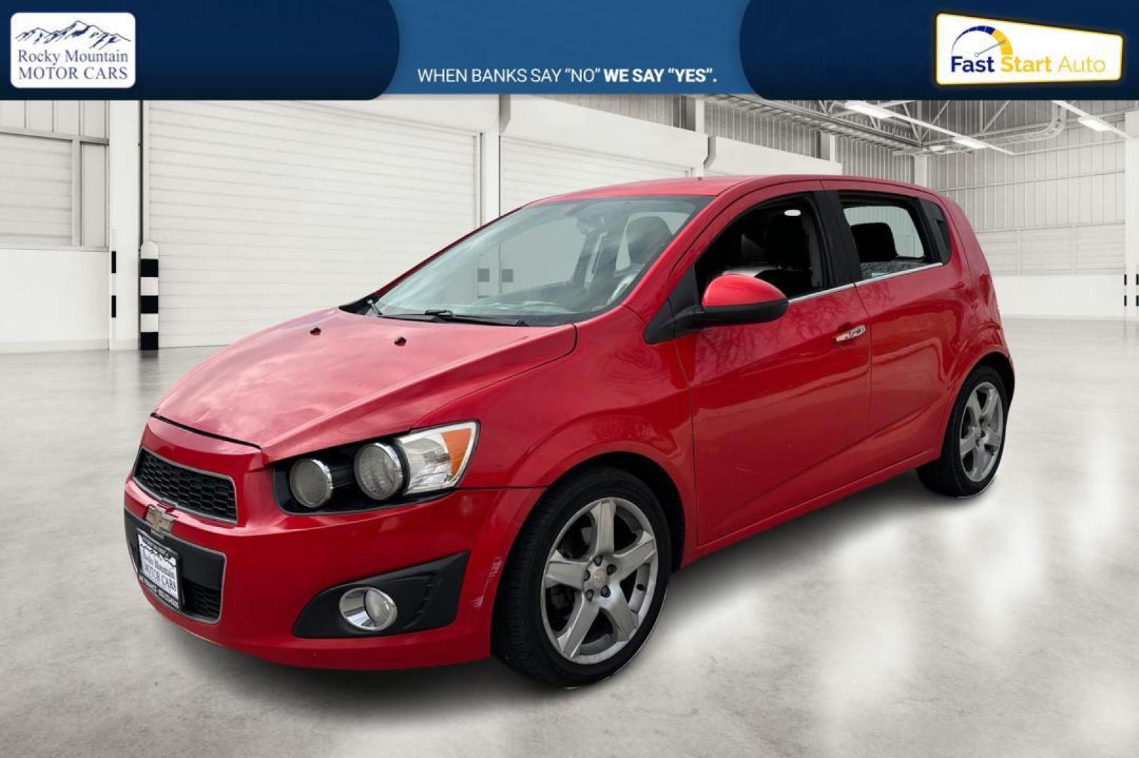 2015 Red Chevrolet Sonic LTZ Auto 5-Door (1G1JE6SB1F4) with an 1.4L L4 DOHC 24V TURBO engine, 6-Speed Automatic transmission, located at 767 S State Road, Pleasant Grove, UT, 84062, (801) 785-1058, 40.354839, -111.736687 - Photo#8