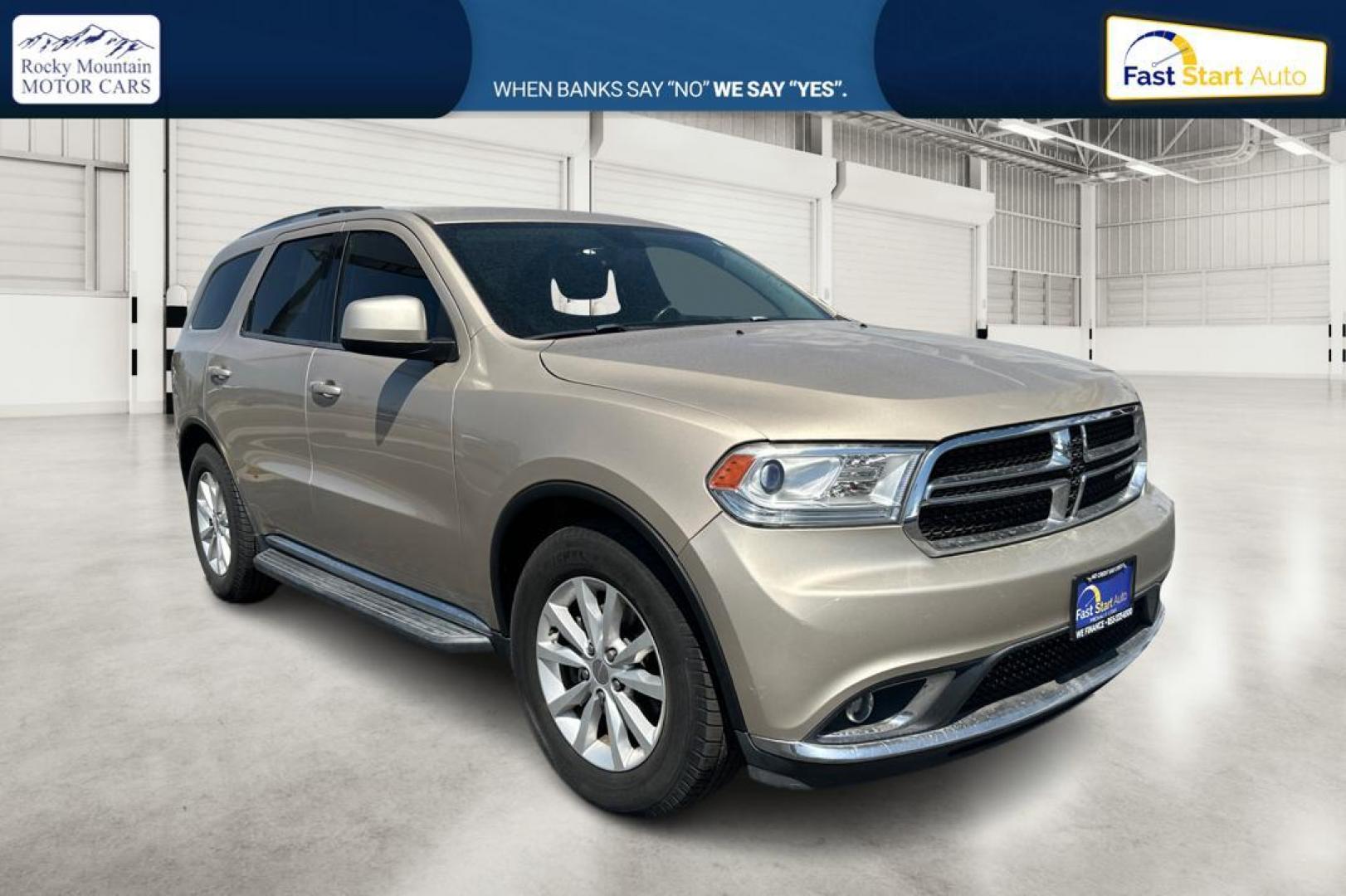 2015 Gold Dodge Durango SXT RWD (1C4RDHAG4FC) with an 3.6L V6 DOHC 24V engine, 8-Speed Automatic transmission, located at 7755 State Street, Midvale, UT, 84047, (801) 753-9063, 40.610329, -111.892159 - Photo#0