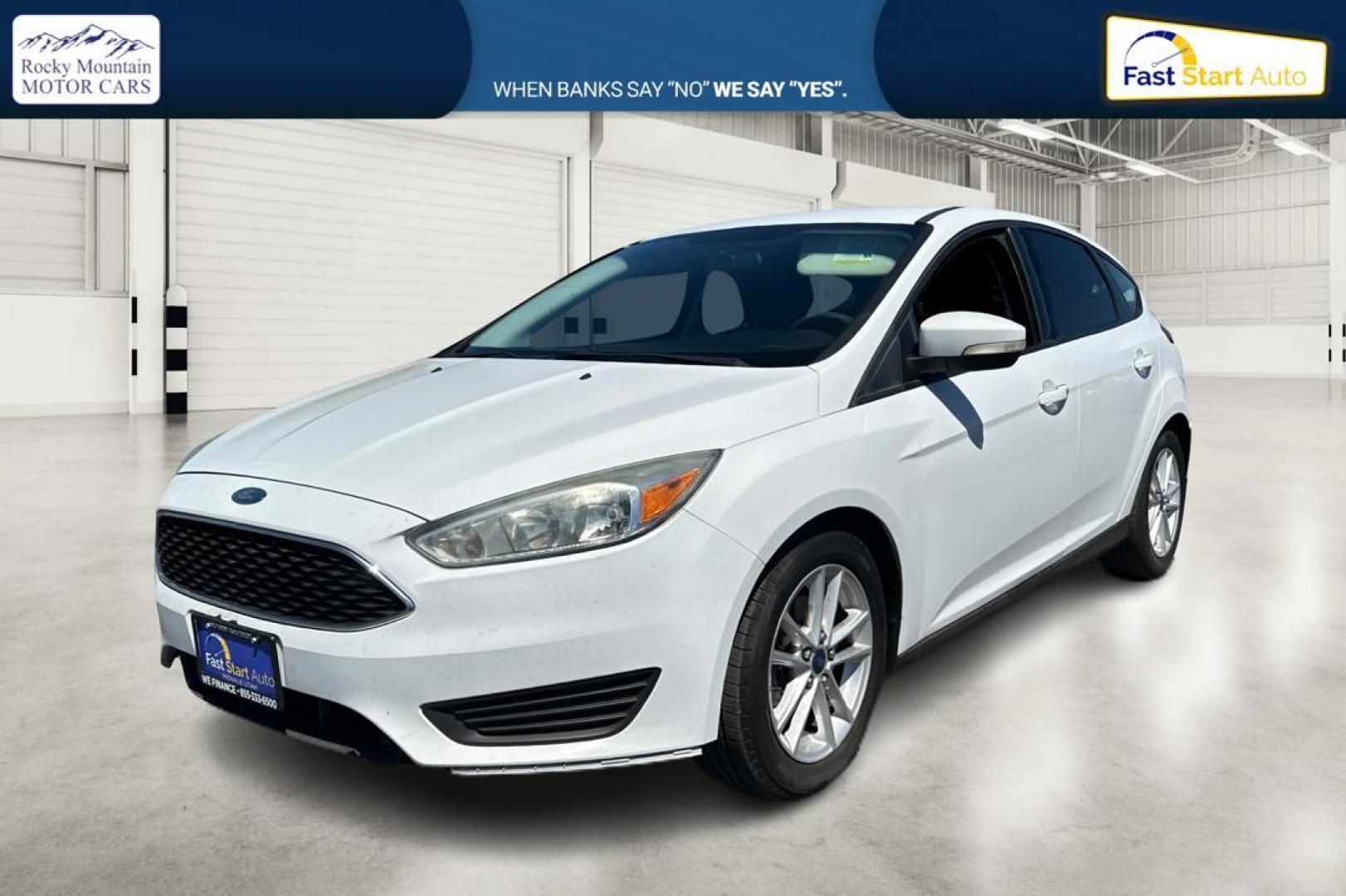 2015 White Ford Focus SE Hatch (1FADP3K23FL) with an 2.0L L4 DOHC 16V engine, 5-Speed Manual transmission, located at 7755 State Street, Midvale, UT, 84047, (801) 753-9063, 40.610329, -111.892159 - Photo#6