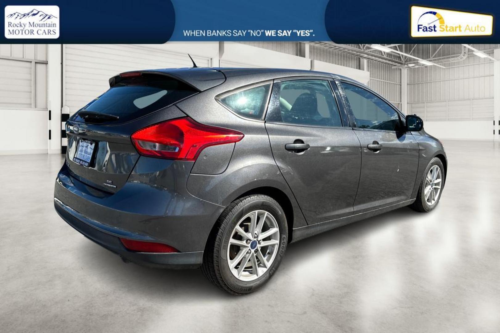 2015 Gray Ford Focus SE Hatch (1FADP3K22FL) with an 2.0L L4 DOHC 16V engine, 5-Speed Manual transmission, located at 344 S Washington Blvd, Ogden, UT, 84404, (801) 399-1799, 41.255482, -111.970848 - Photo#2