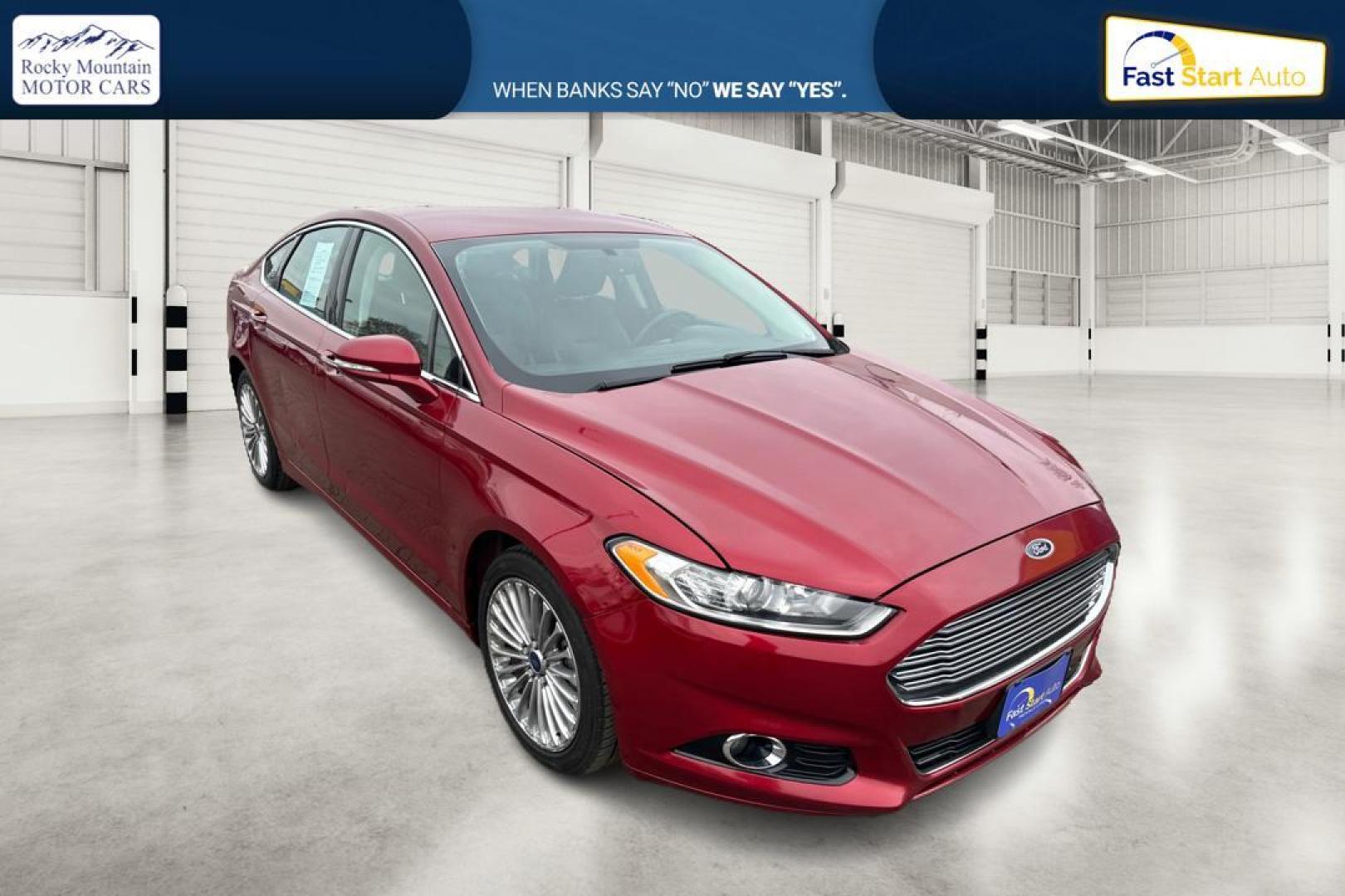 2015 Red Ford Fusion Titanium AWD (3FA6P0D90FR) with an 2.0L L4 DOHC 16V engine, Auto, 6-Spd w/SelShft transmission, located at 767 S State Road, Pleasant Grove, UT, 84062, (801) 785-1058, 40.354839, -111.736687 - Photo#0