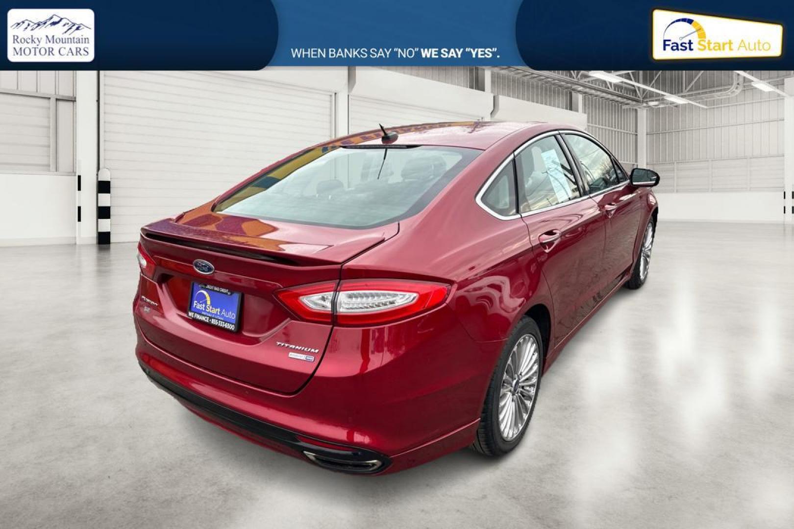 2015 Red Ford Fusion Titanium AWD (3FA6P0D90FR) with an 2.0L L4 DOHC 16V engine, Auto, 6-Spd w/SelShft transmission, located at 767 S State Road, Pleasant Grove, UT, 84062, (801) 785-1058, 40.354839, -111.736687 - Photo#1